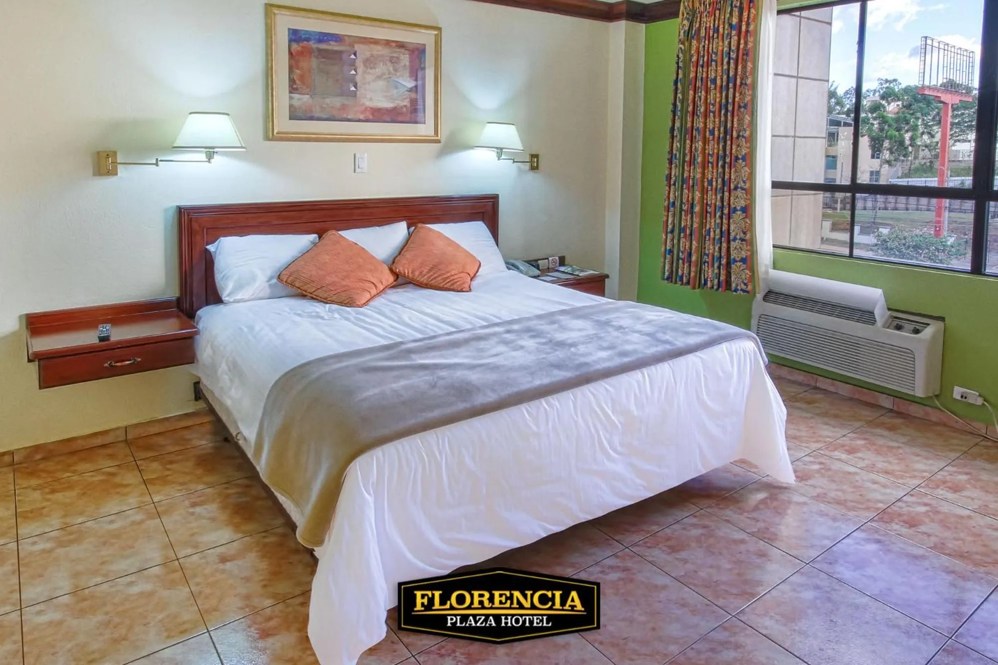 Bed in FLORENCIA PLAZA HOTEL
