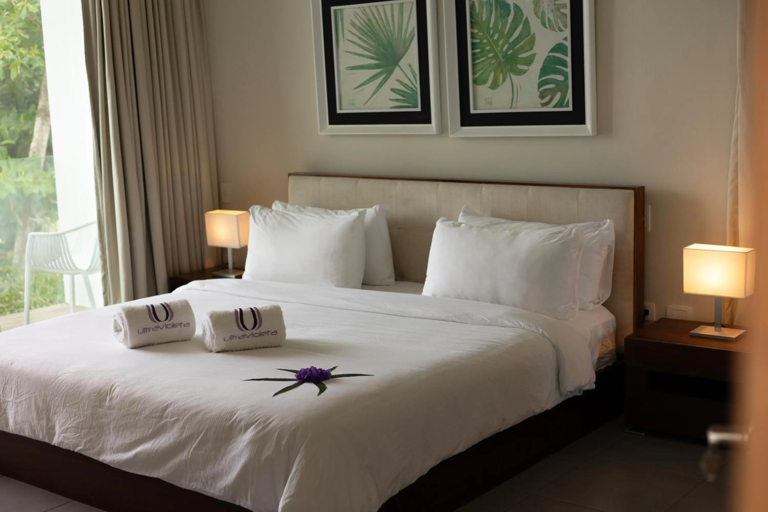 Bed in Ultravioleta Boutique Residences