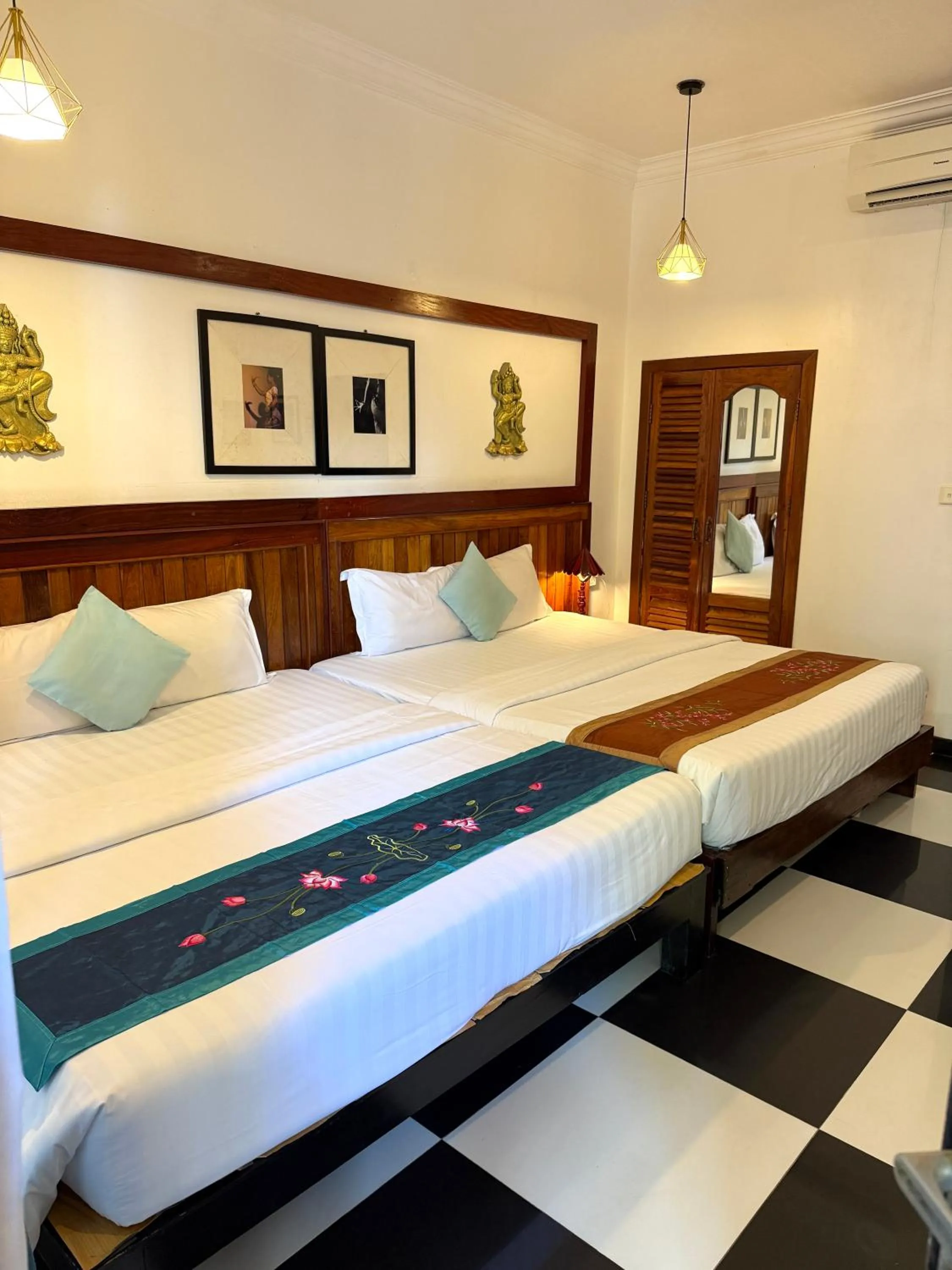 Bed in Asanak D'Angkor Boutique Hotel
