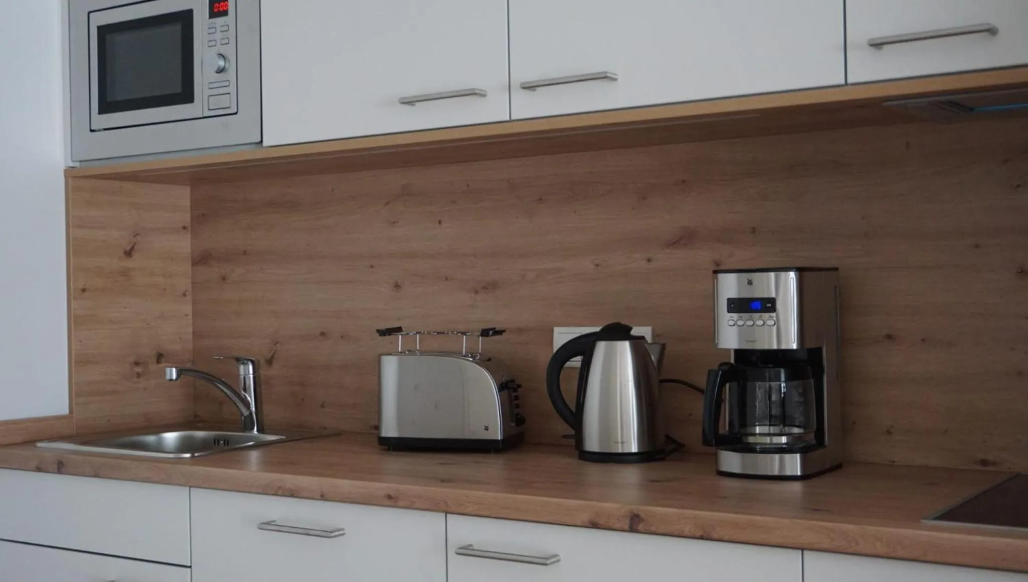 Kitchen or kitchenette in Sporthotel Neuruppin - Apartmenthaus mit Ferienwohnungen