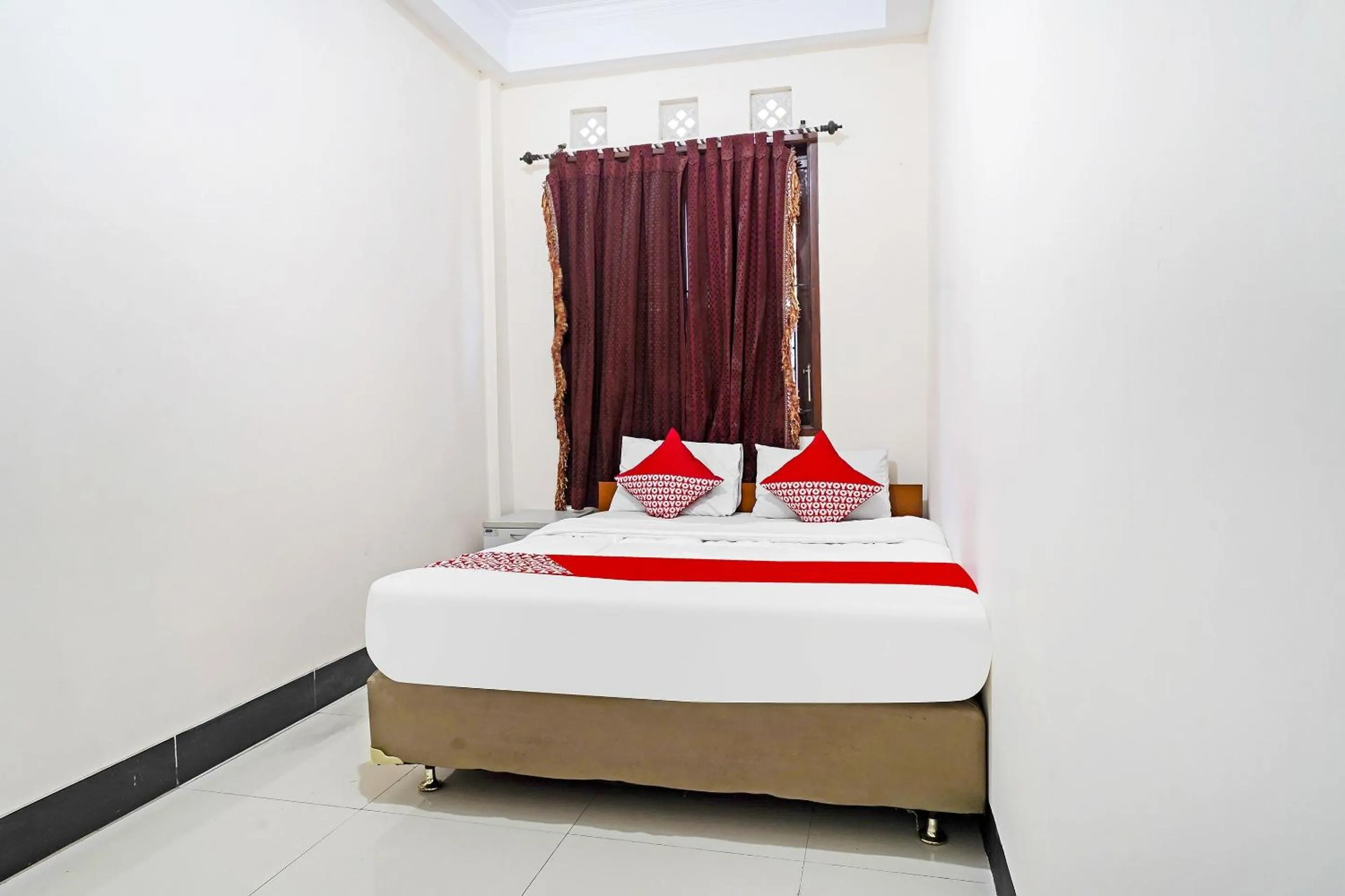 Bedroom in Hotel O Jawara Guest House Syariah