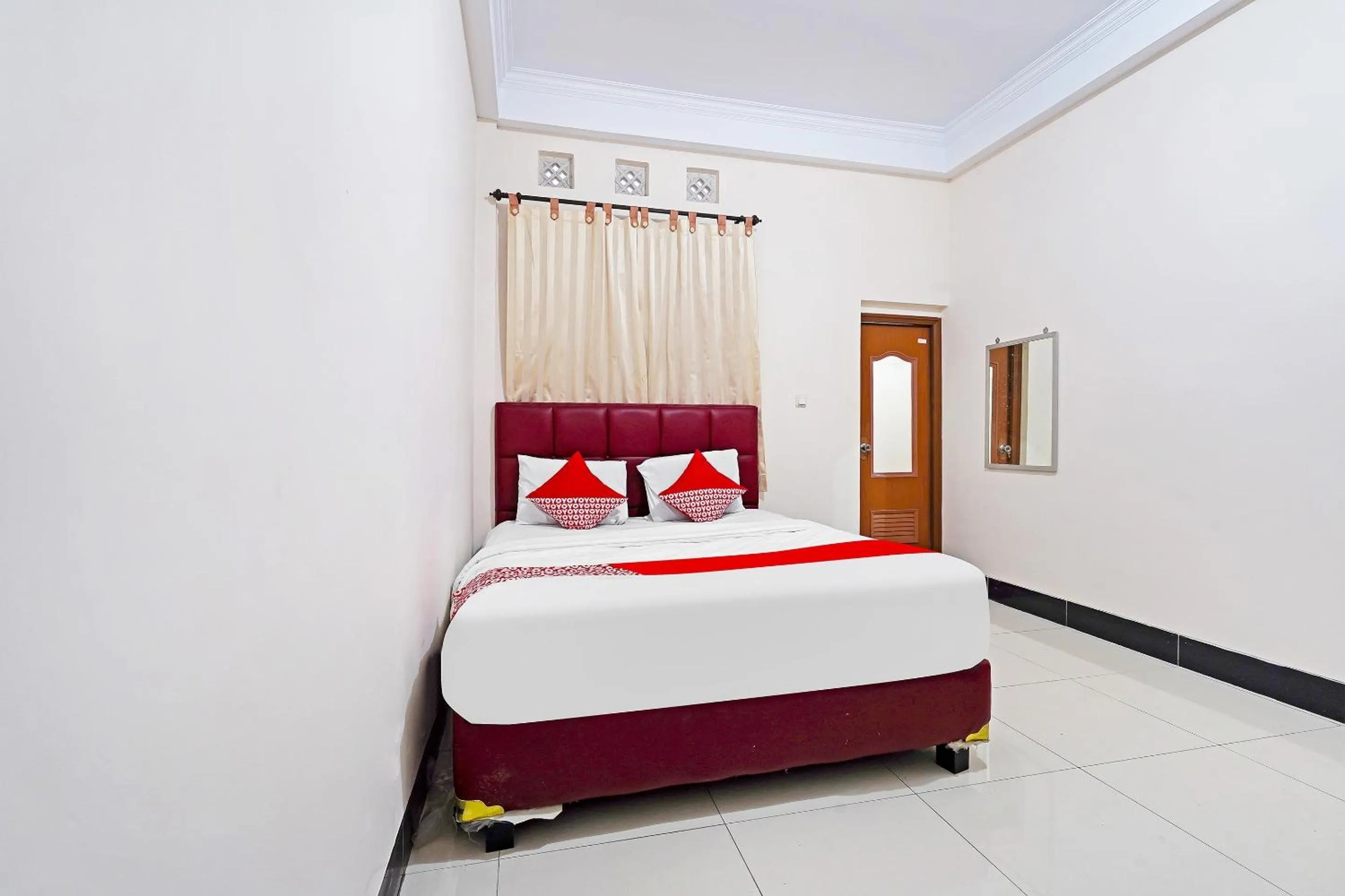 Bedroom in Hotel O Jawara Guest House Syariah