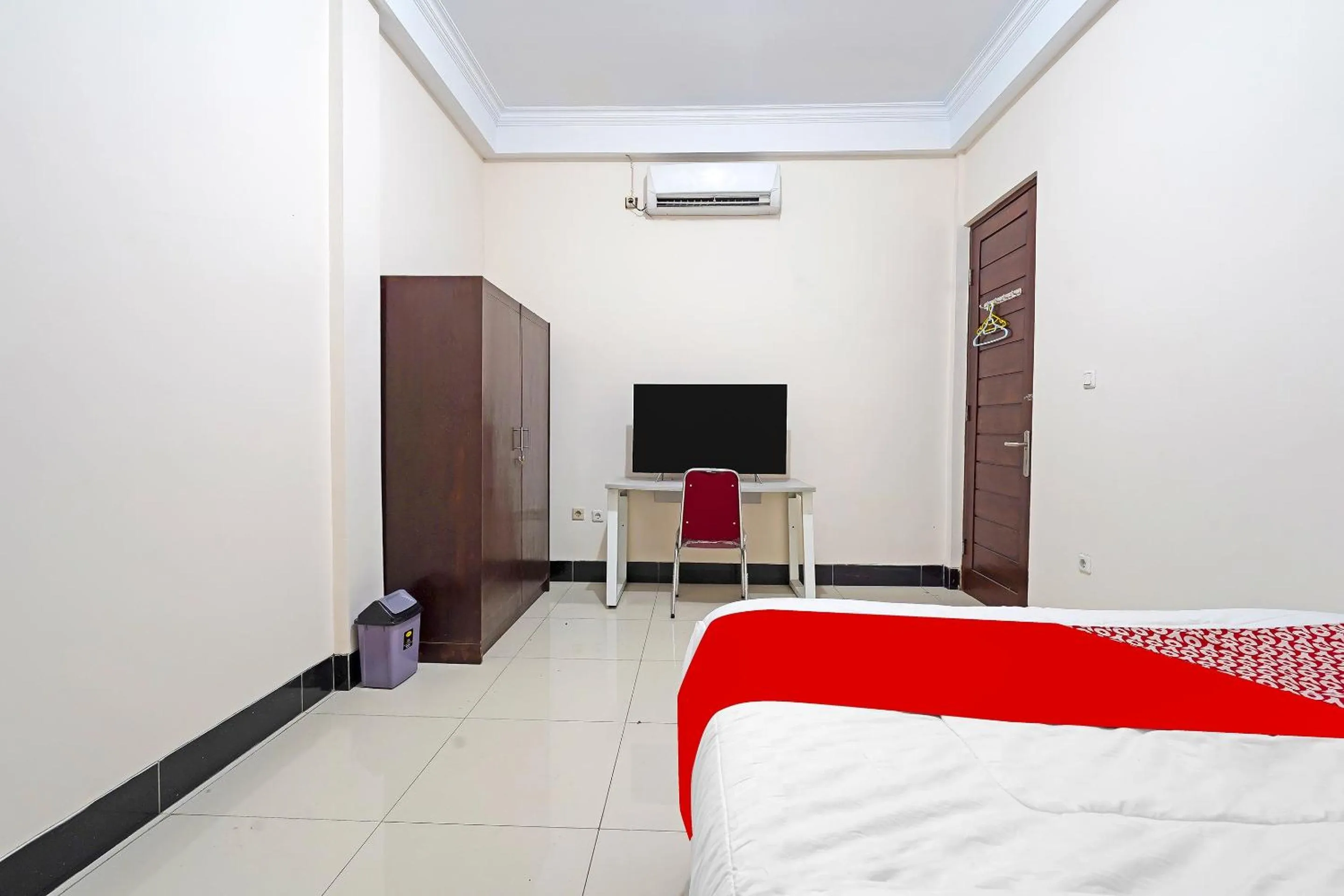 Bedroom in Hotel O Jawara Guest House Syariah
