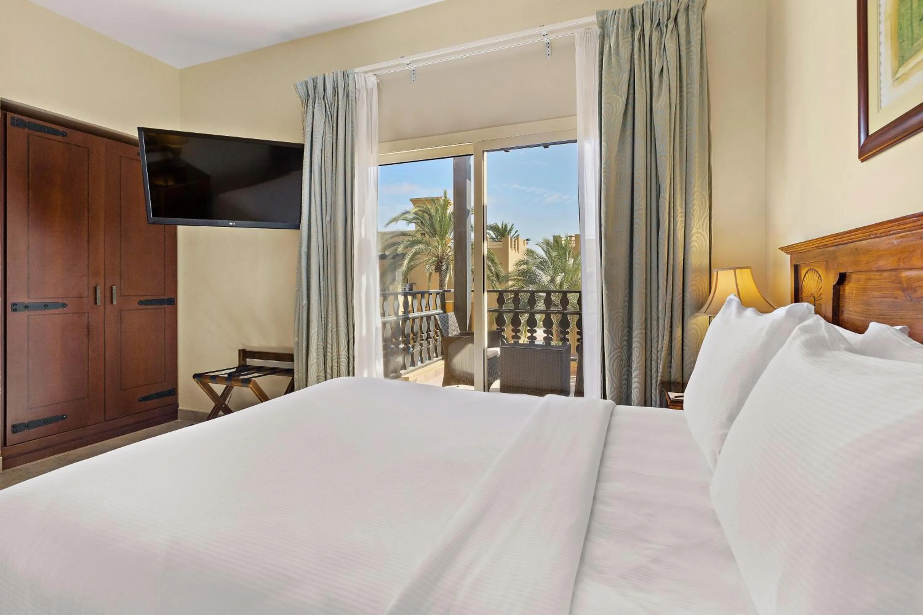 Bed in Al Hamra Village Hotel