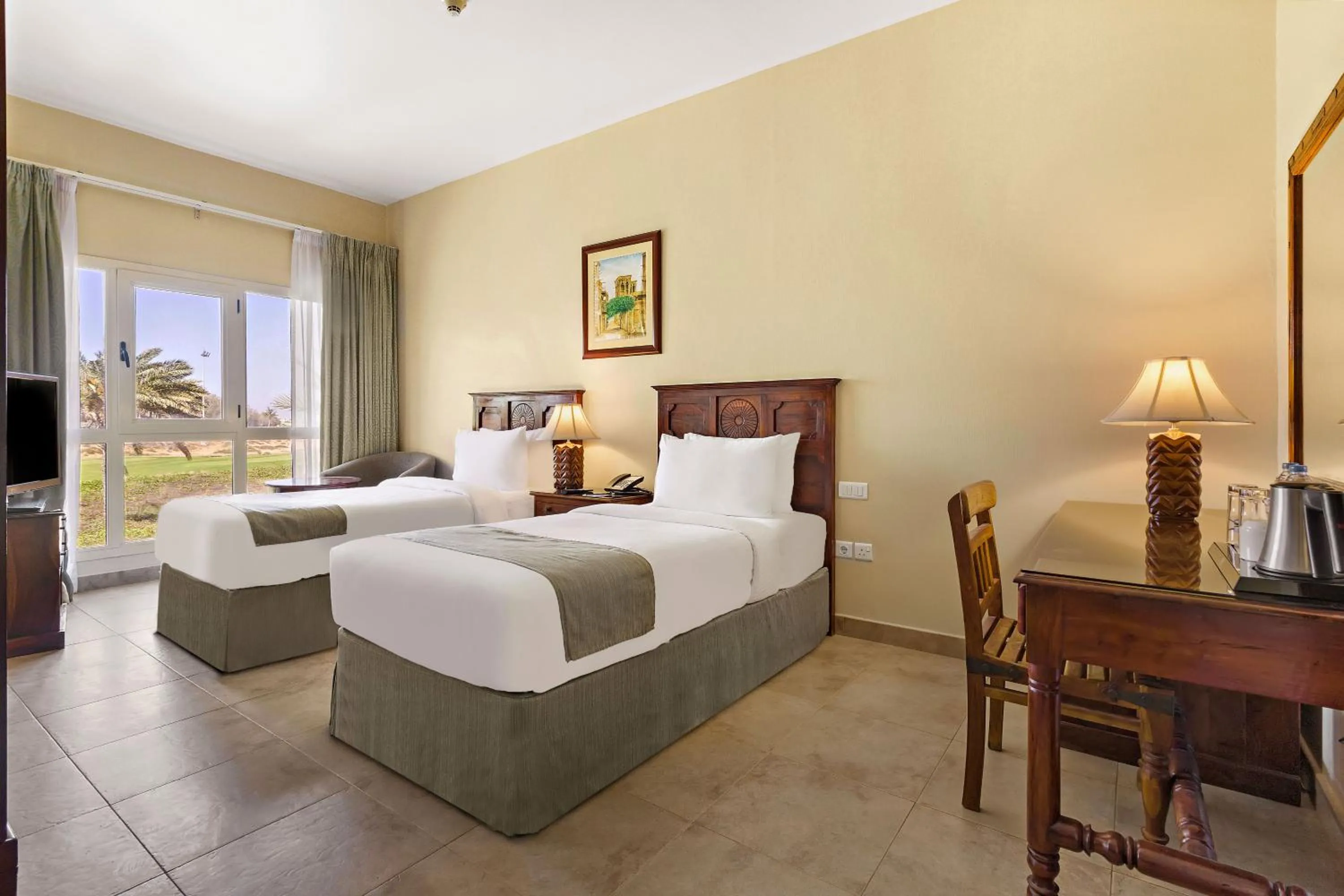 Bed in Al Hamra Village Hotel