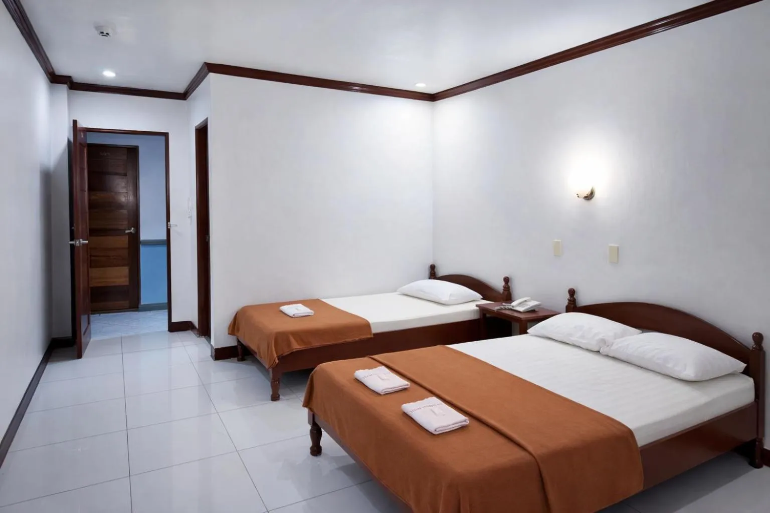 Bed in La Elliana Hotel & Restaurant, Inc.