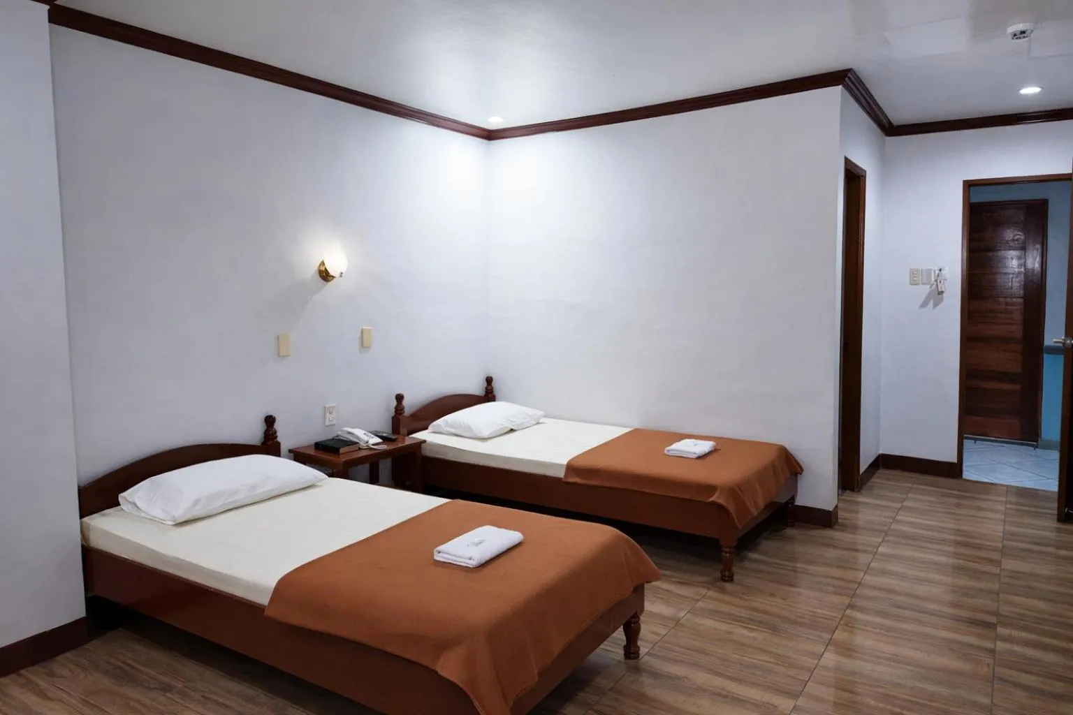 Bed in La Elliana Hotel & Restaurant, Inc.