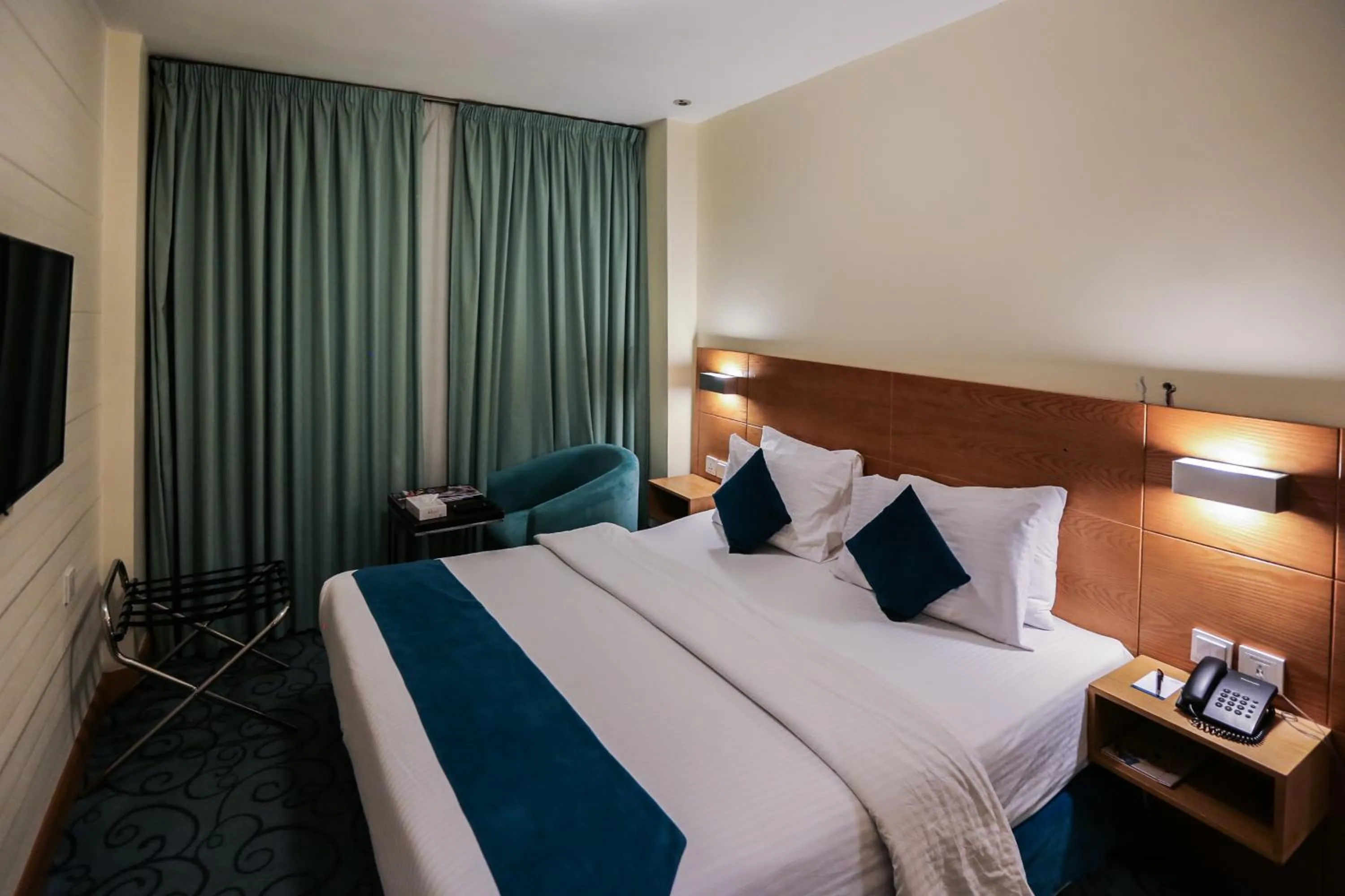 Bed in Khuttar Apartment