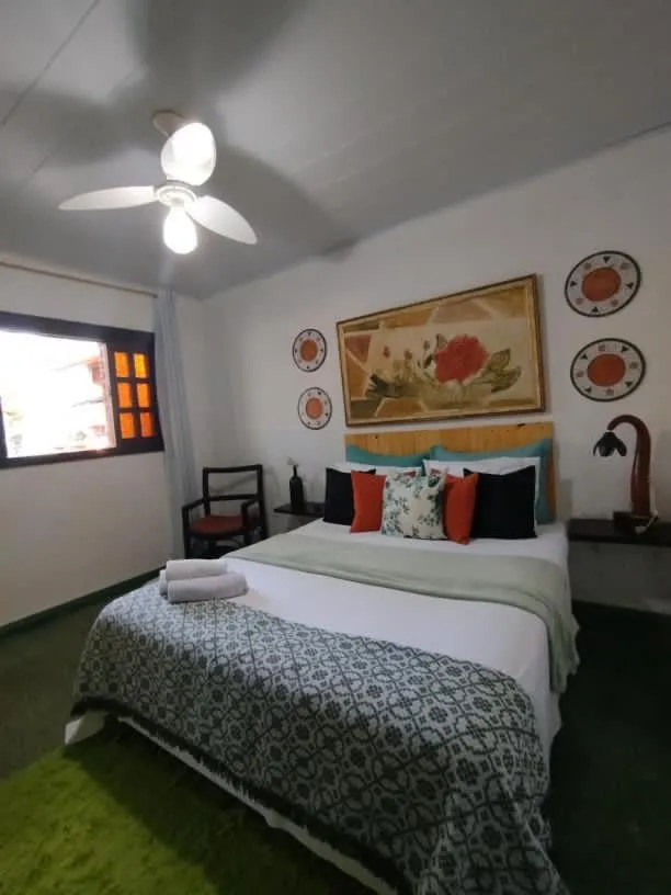 Bed in Pousada Recanto dos Leões