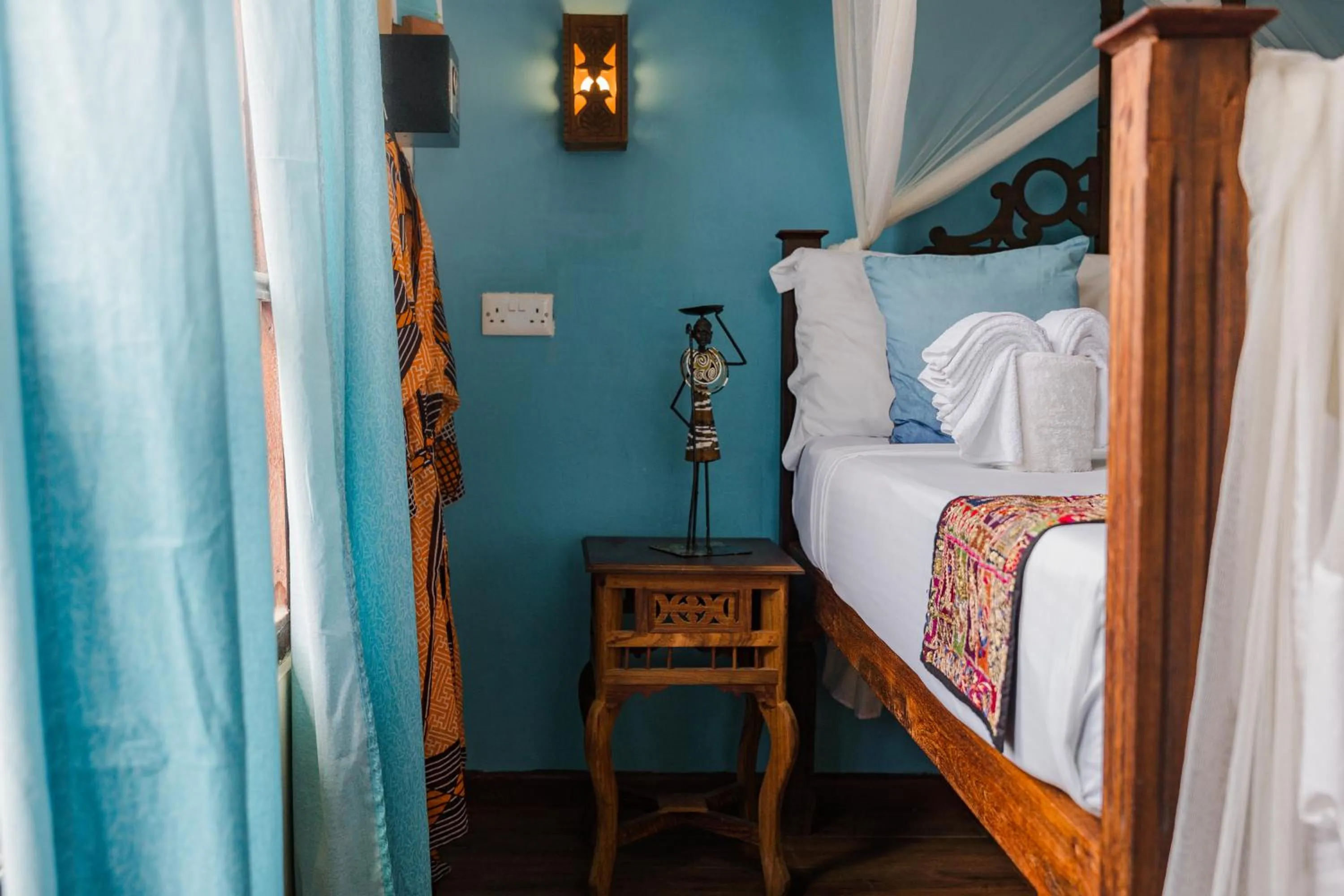 Bed in Emerald Palm Boutique Hotel