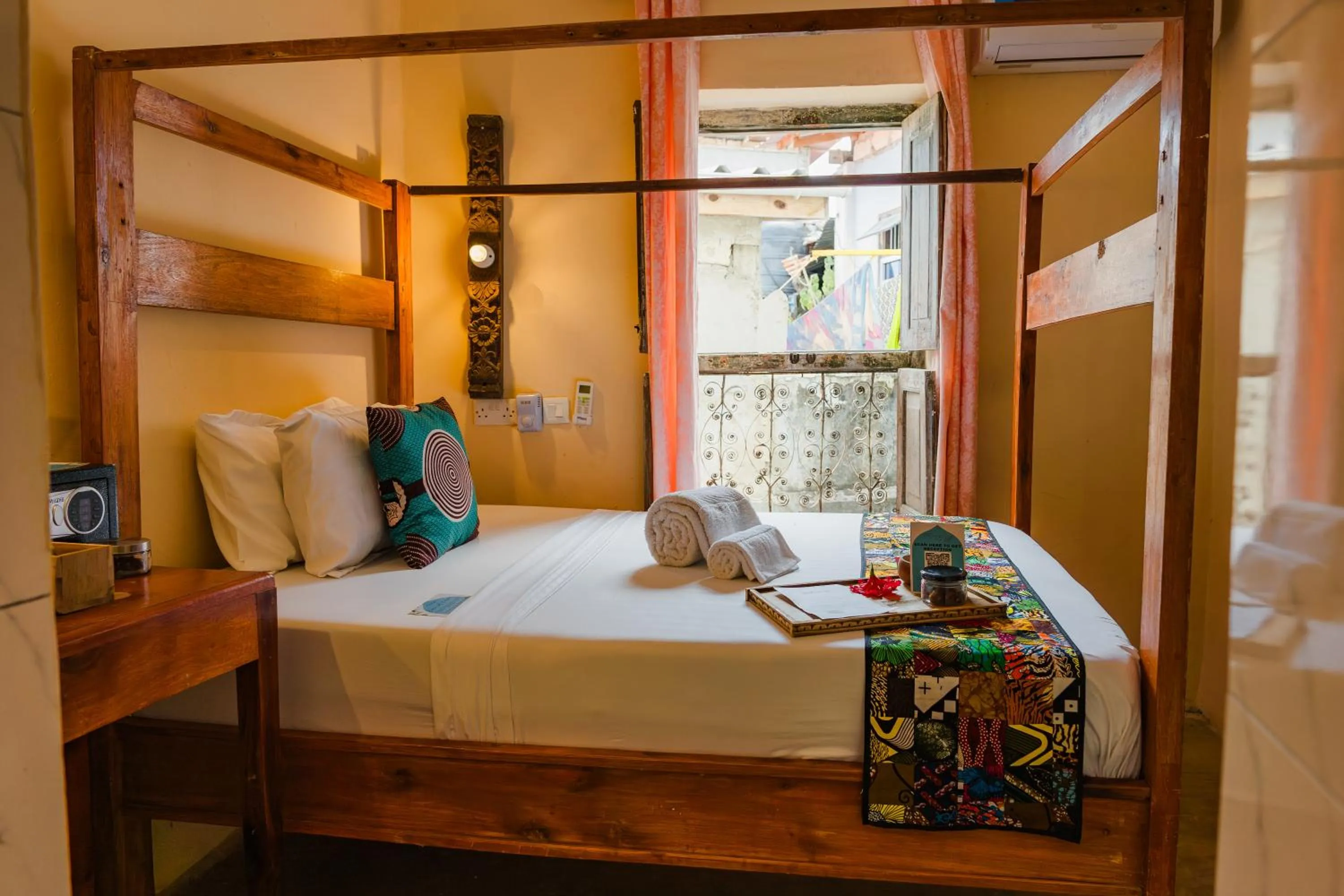 Bed in Emerald Palm Boutique Hotel