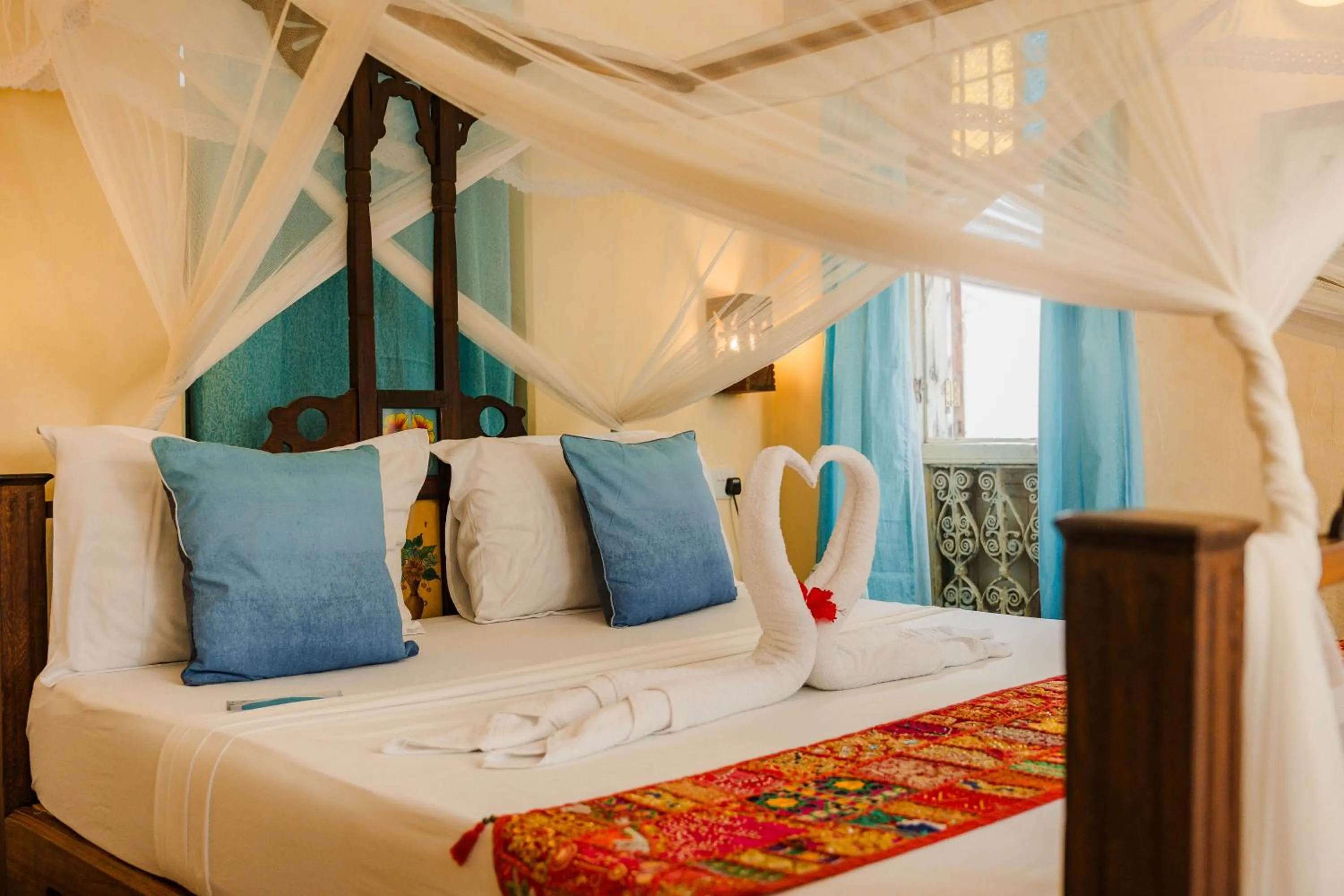 Bed in Emerald Palm Boutique Hotel