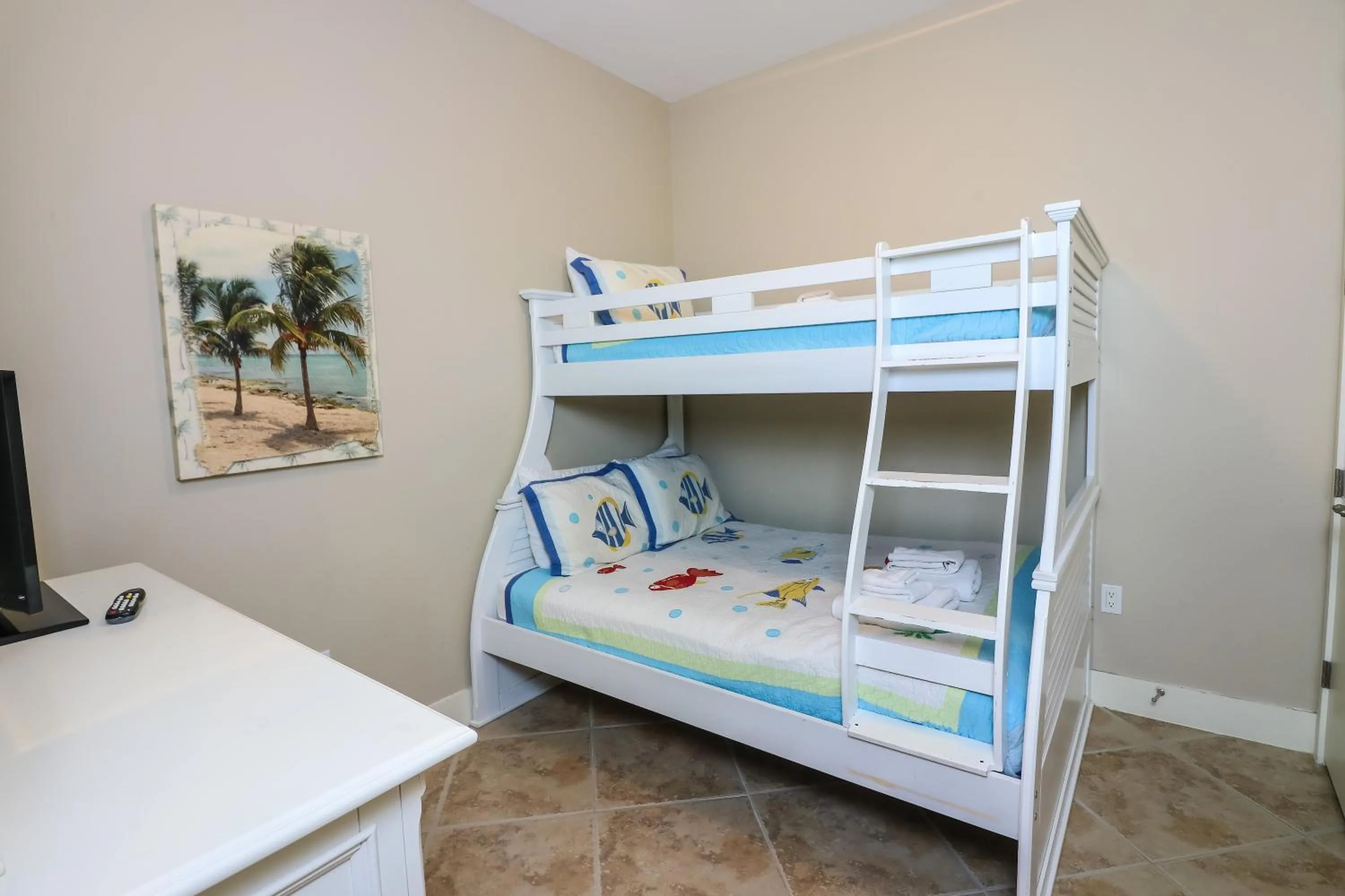 Bed in Beachfront Laid Back and Luxurious Diamond Beach Condo - Amazing Pools Amenities