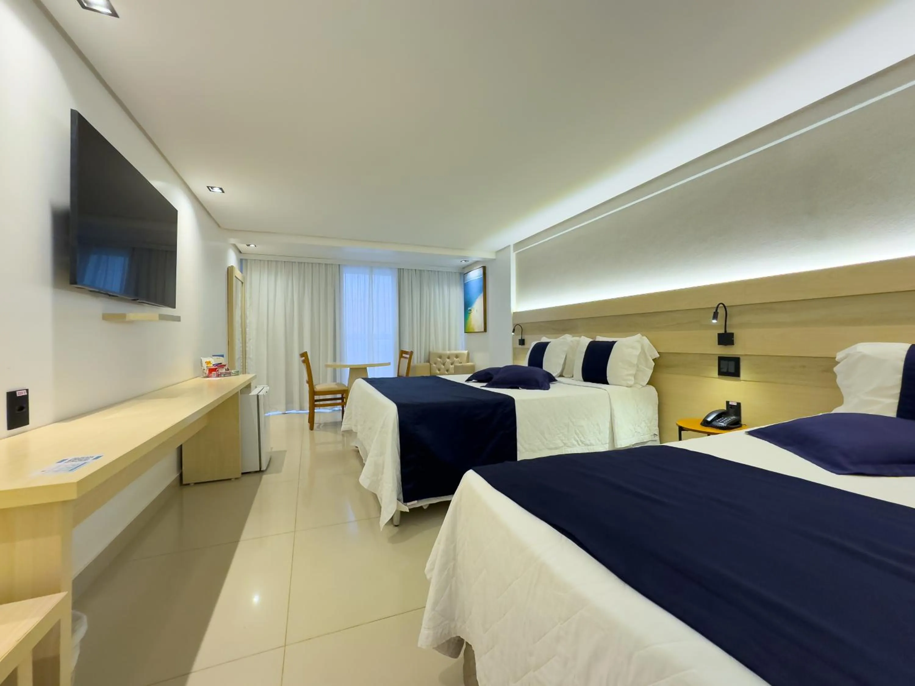 Communal lounge/ TV room, Bed in Laguna Praia Hotel