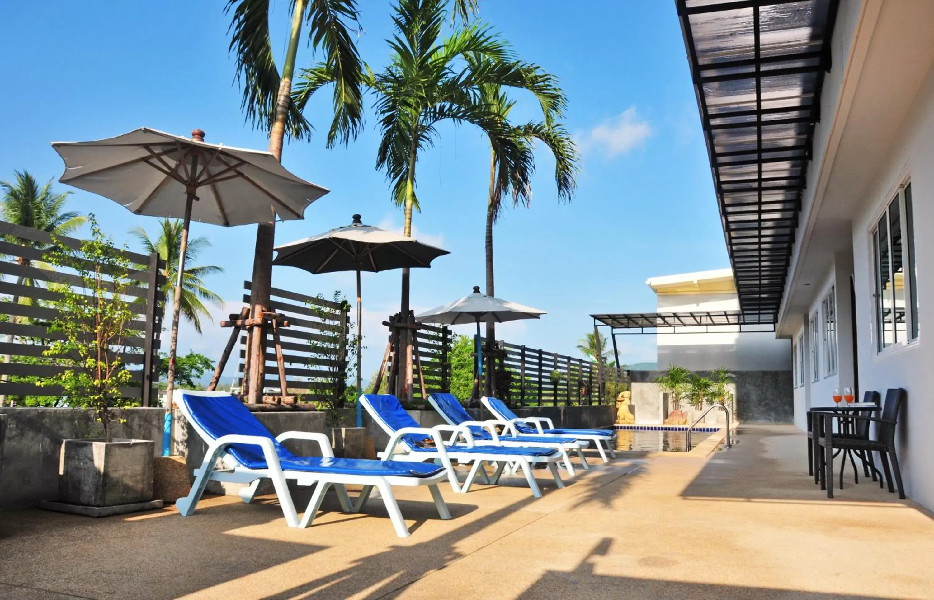 Swimming pool in AM Surin Place - SHA Extra Plus Swimming pool in AM Surin Place - SHA Extra Plus