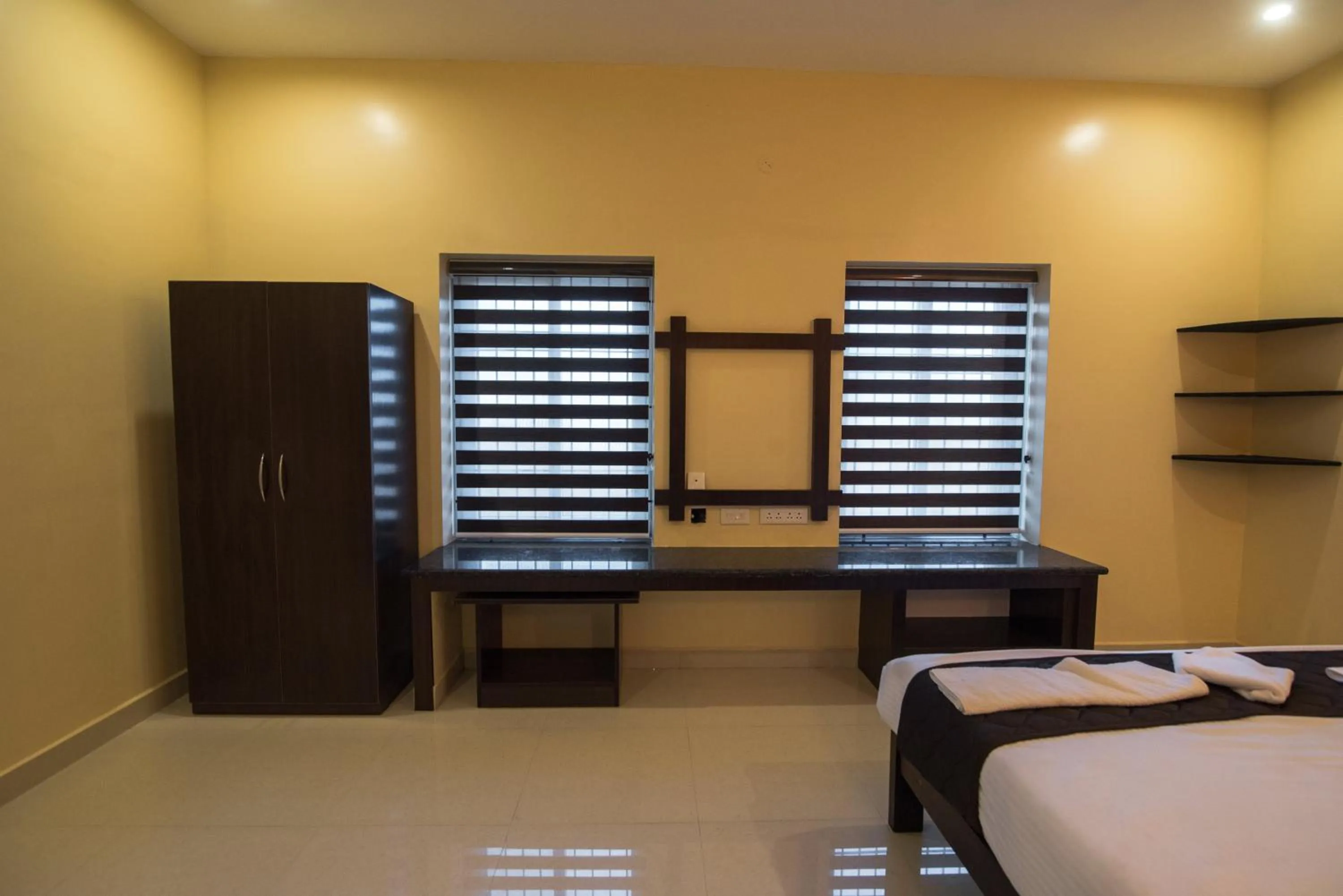 Seating area, Bed in Saffron Vilva