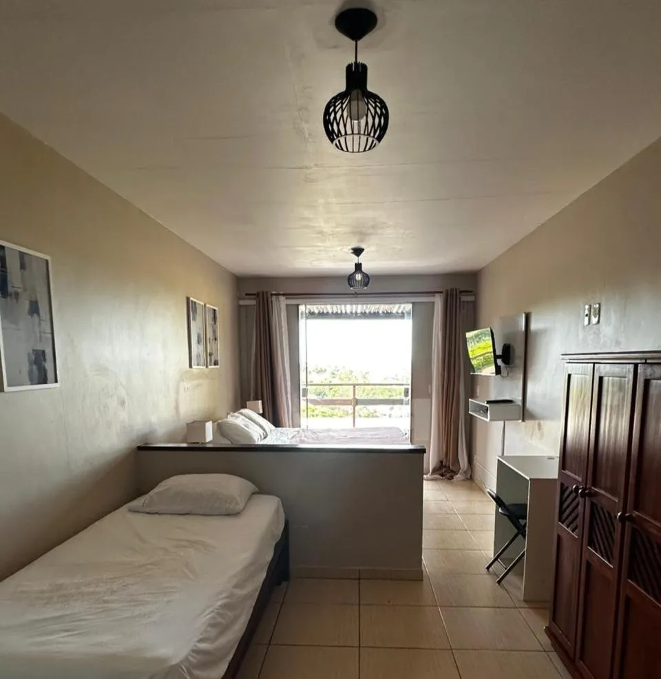 Photo of the whole room, Bed in Pousada Zanzibar