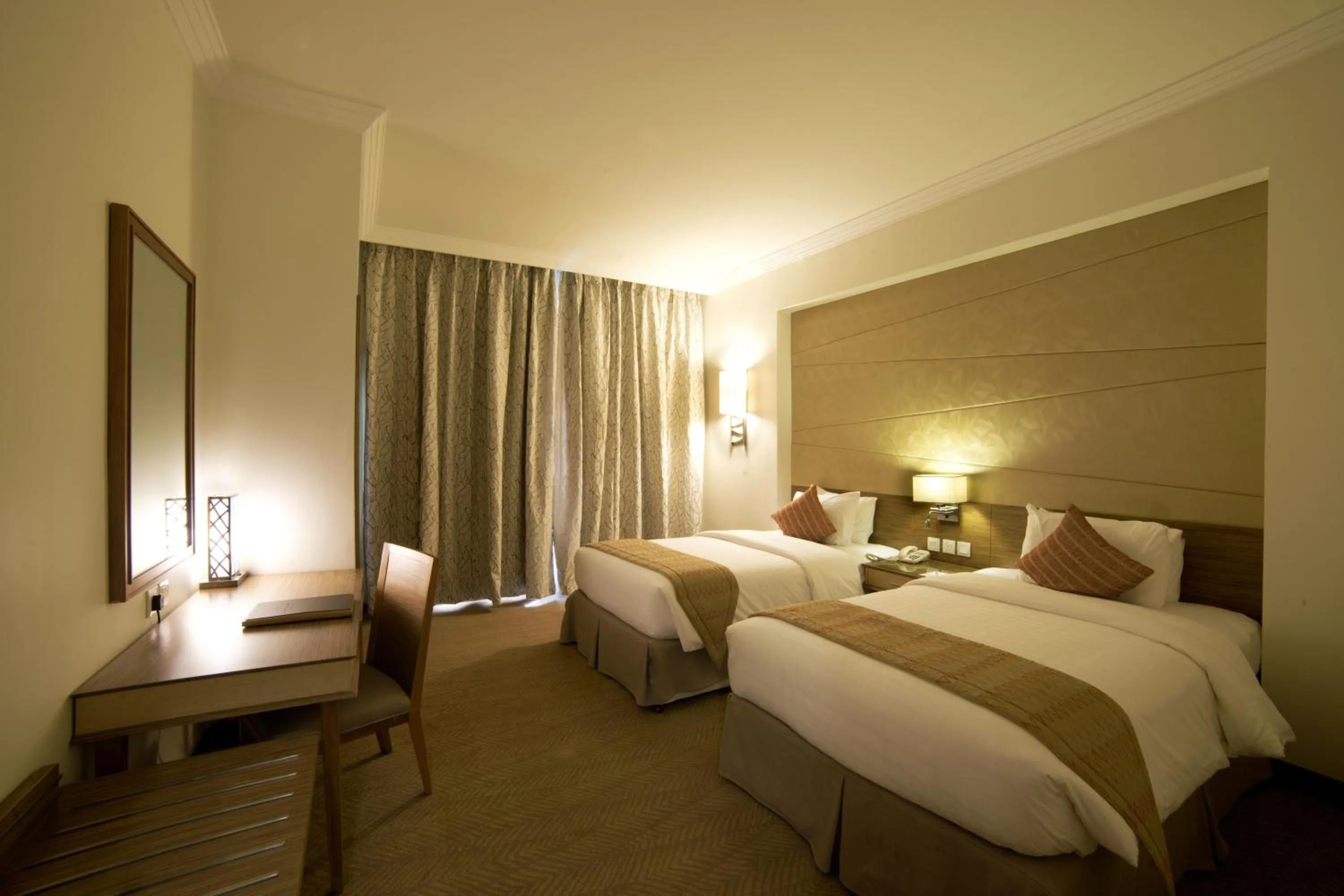 Bed in Golden Tulip Dammam Corniche Hotel