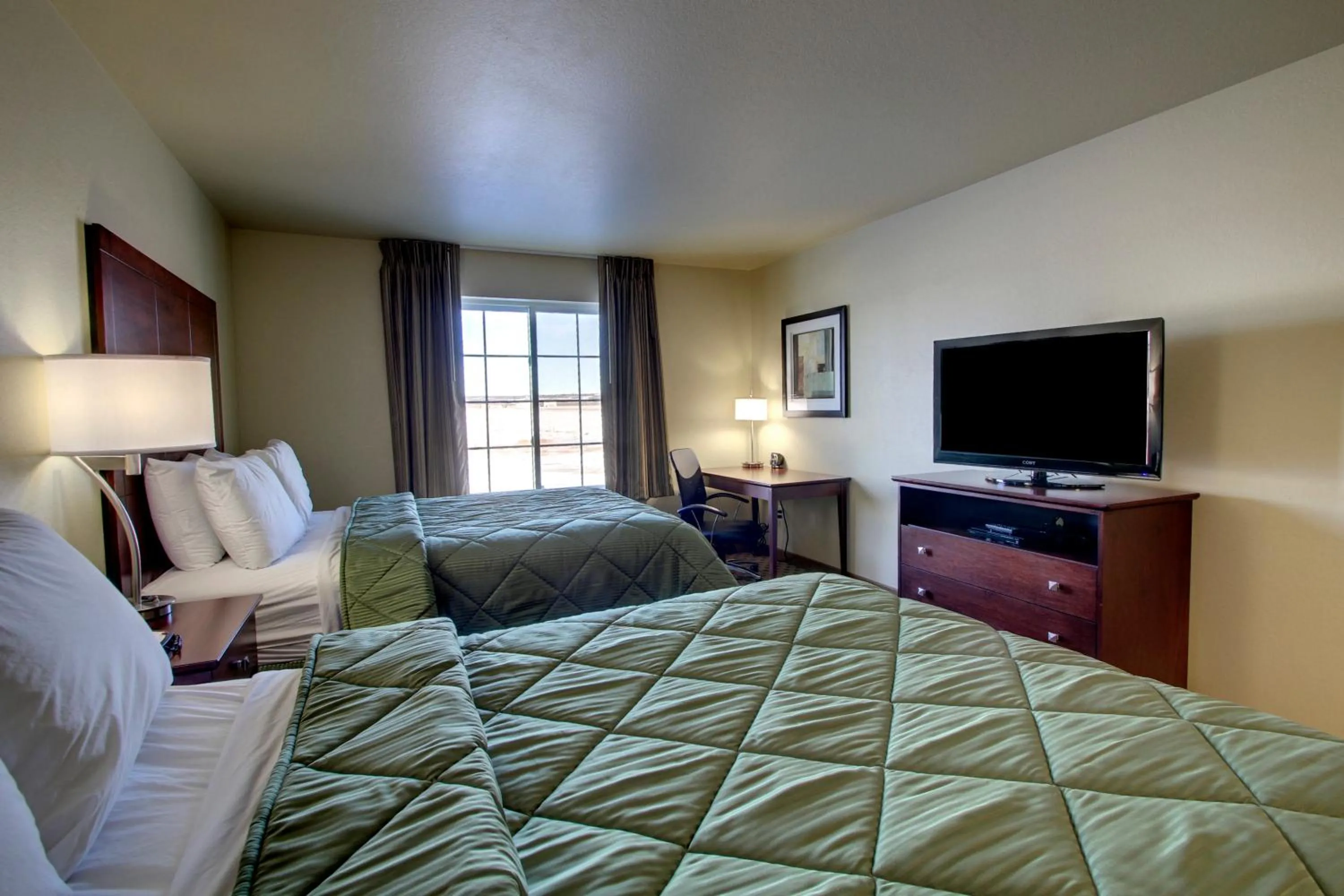 Bed in Cobblestone Inn & Suites - Harper