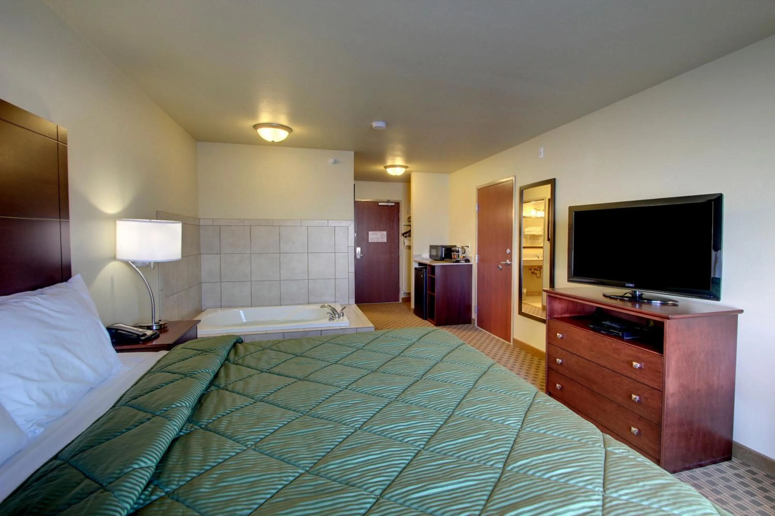 Bed in Cobblestone Inn & Suites - Harper