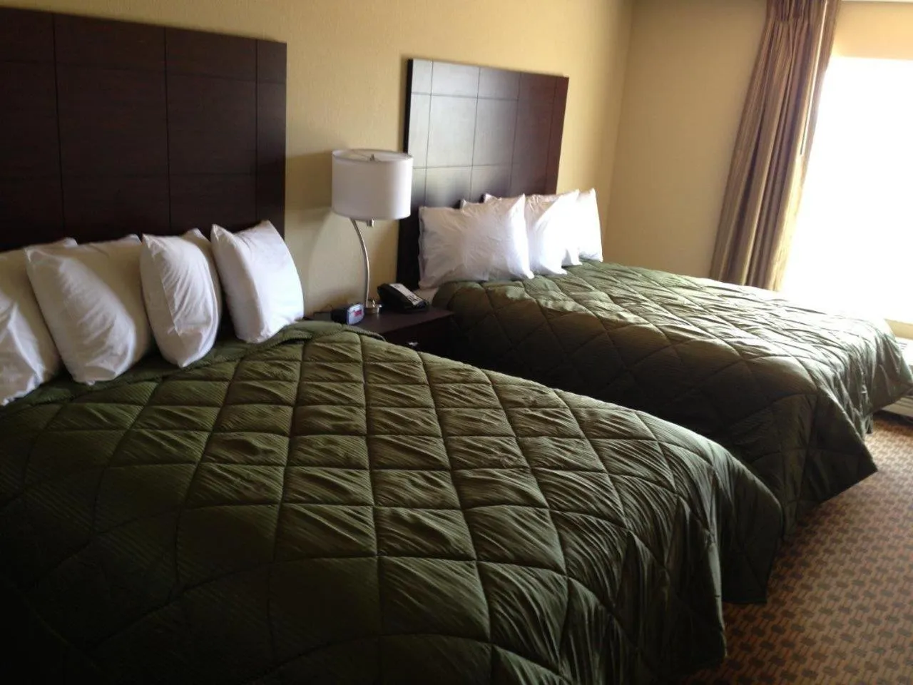 Bed in Cobblestone Inn & Suites - Harper