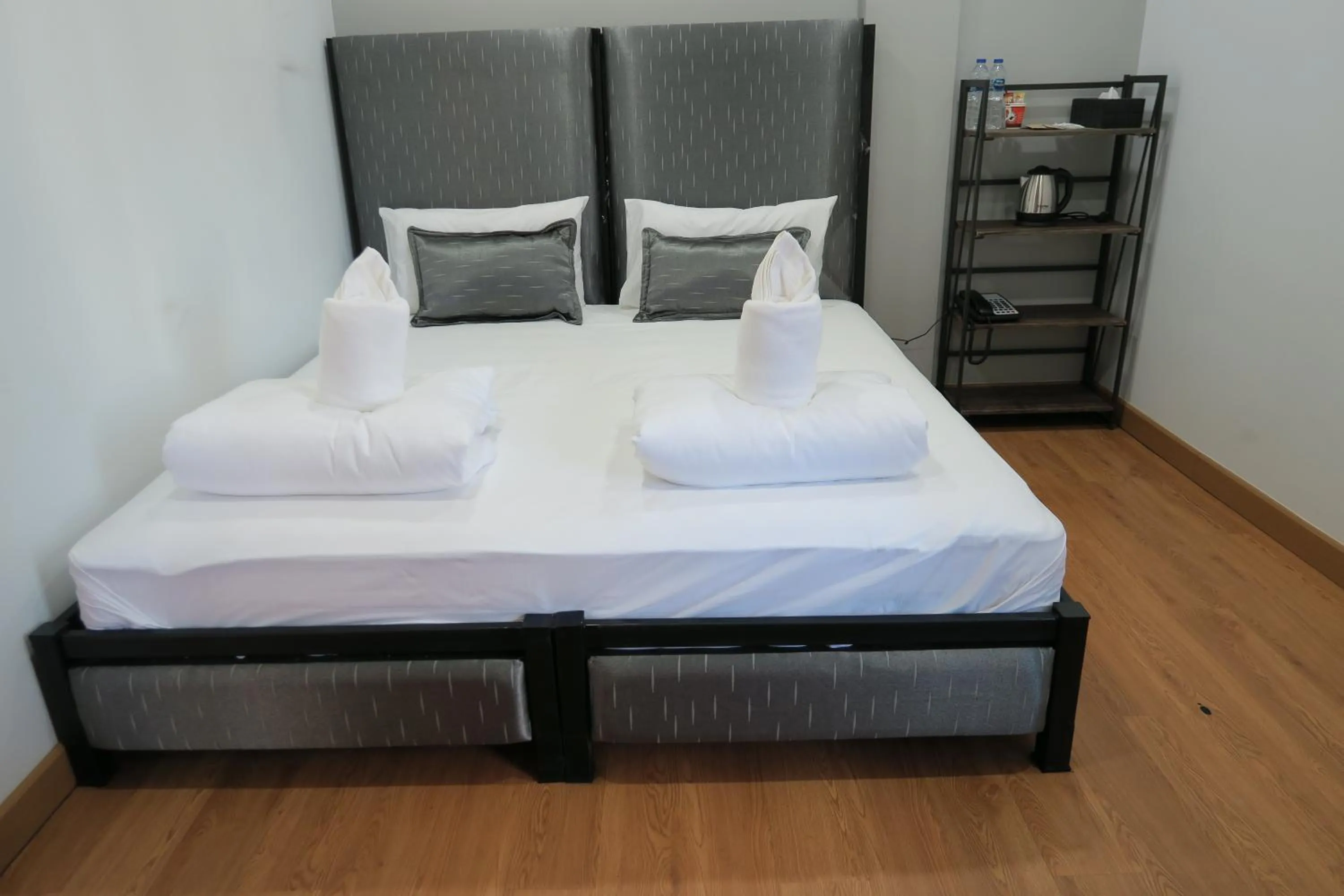 Bed in The Mira Hotel Chiang Rai