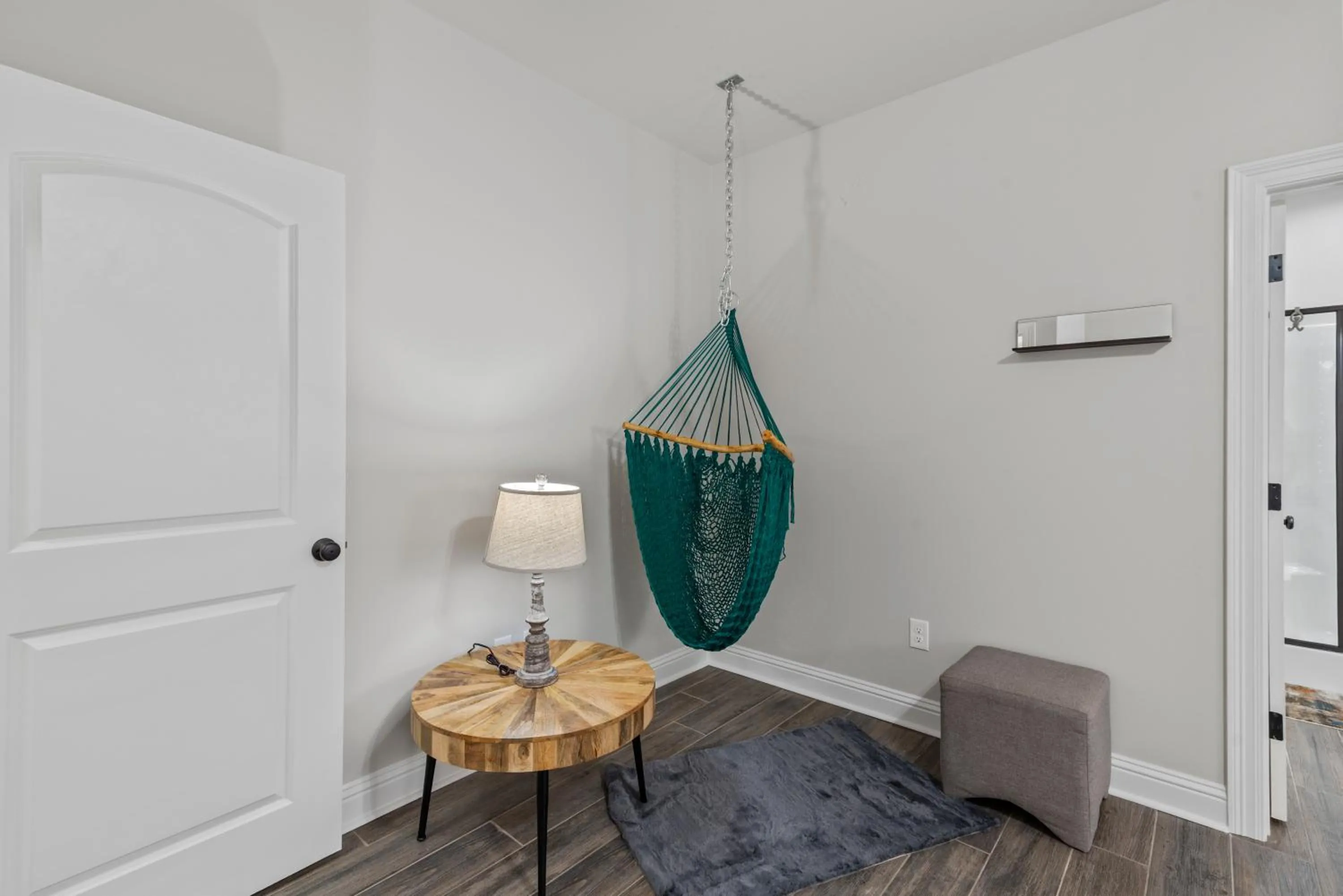 Seating area in Zen House, a peaceful sanctuary in Shreveport, LA! Tv in each room