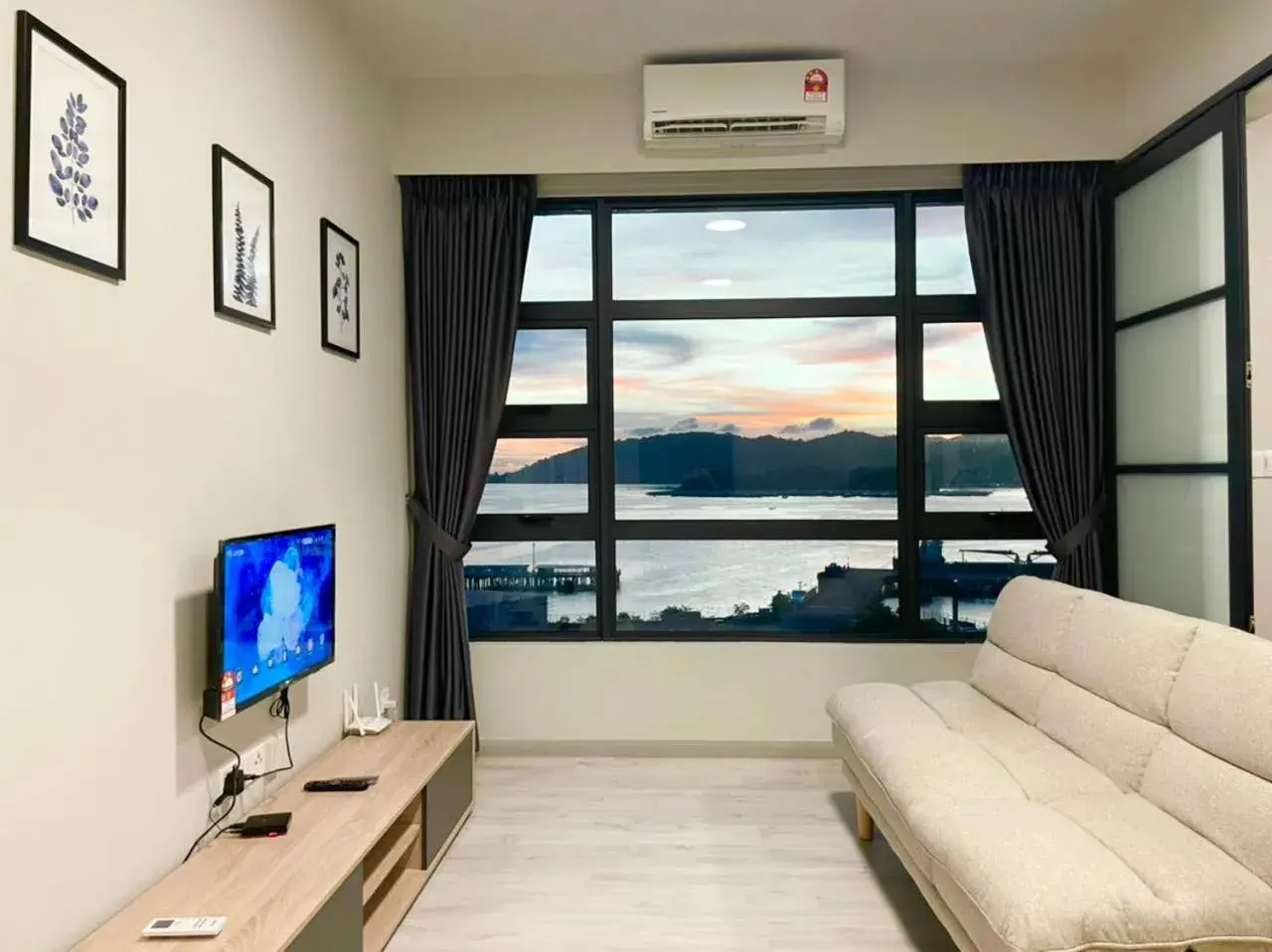 Living room in Sunset Seaview Vacation Condos @ Jesselton Quay Living room in Sunset Seaview Vacation Condos @ Jesselton Quay