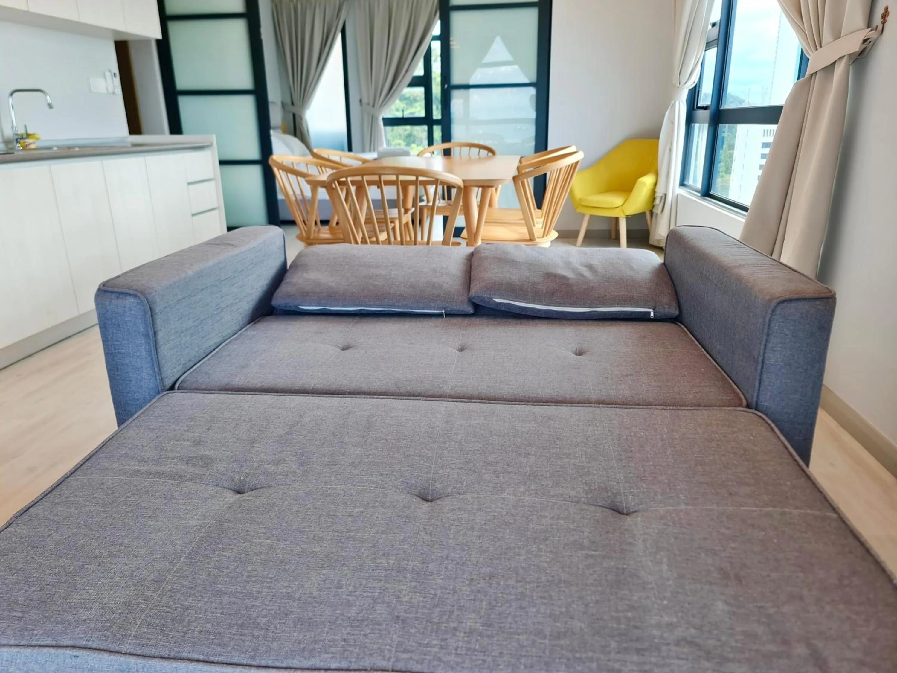 Living room, Bed in Sunset Seaview Vacation Condos @ Jesselton Quay