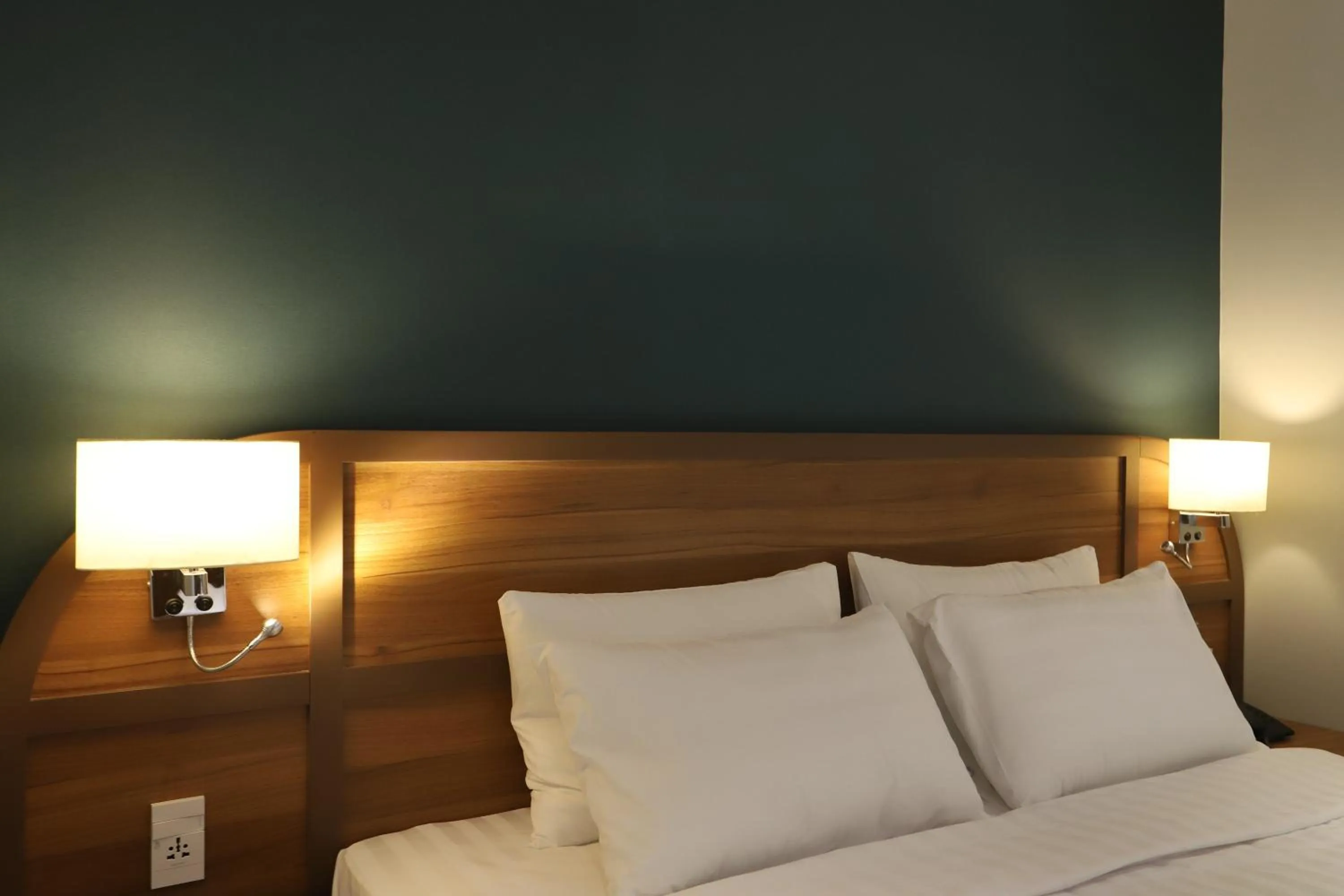 Bed in Lanura Apartments and Hotel