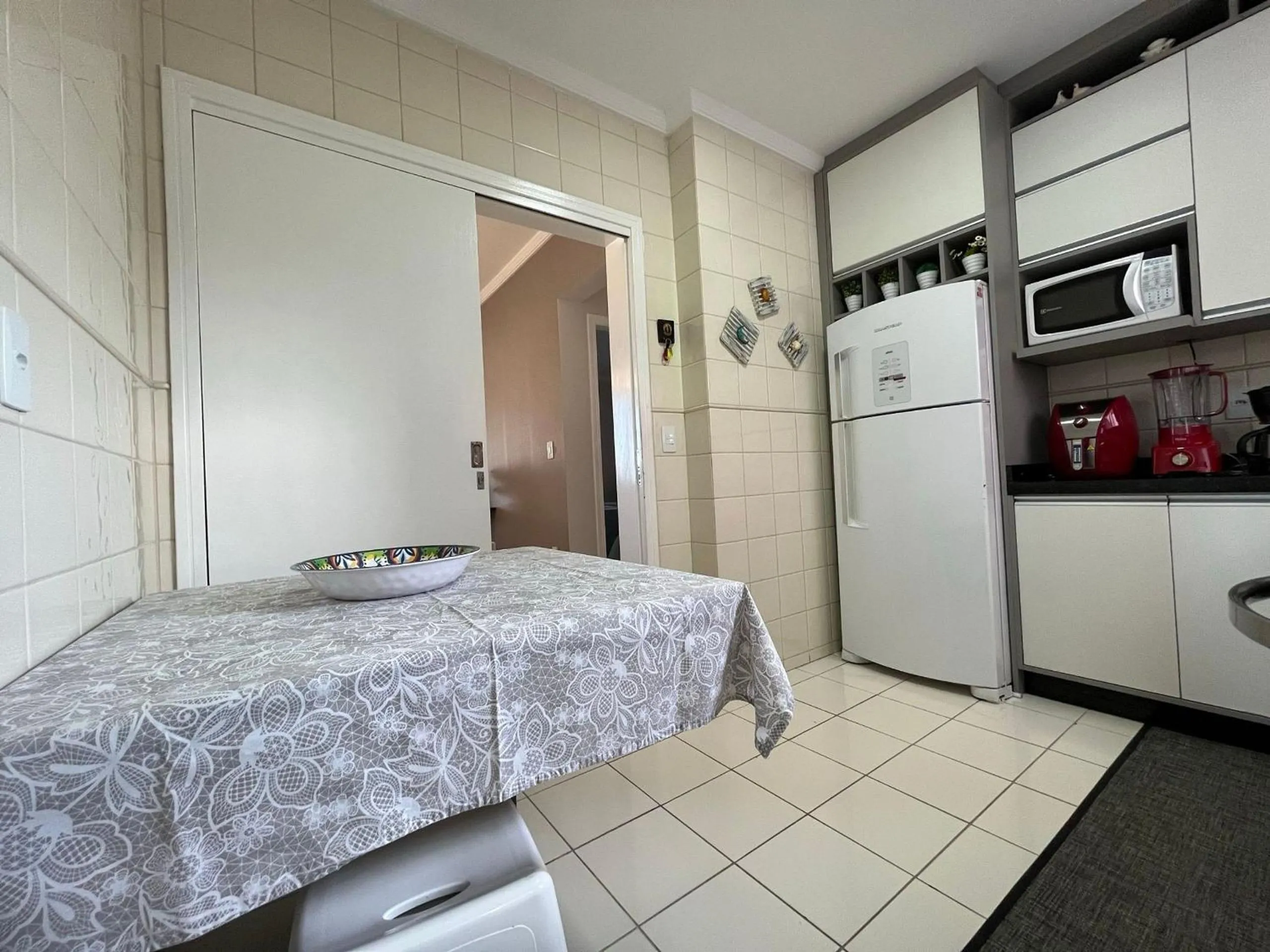 Kitchen or kitchenette in CT01- Vista mar| Telas Proteção| Churrasq, Garagem