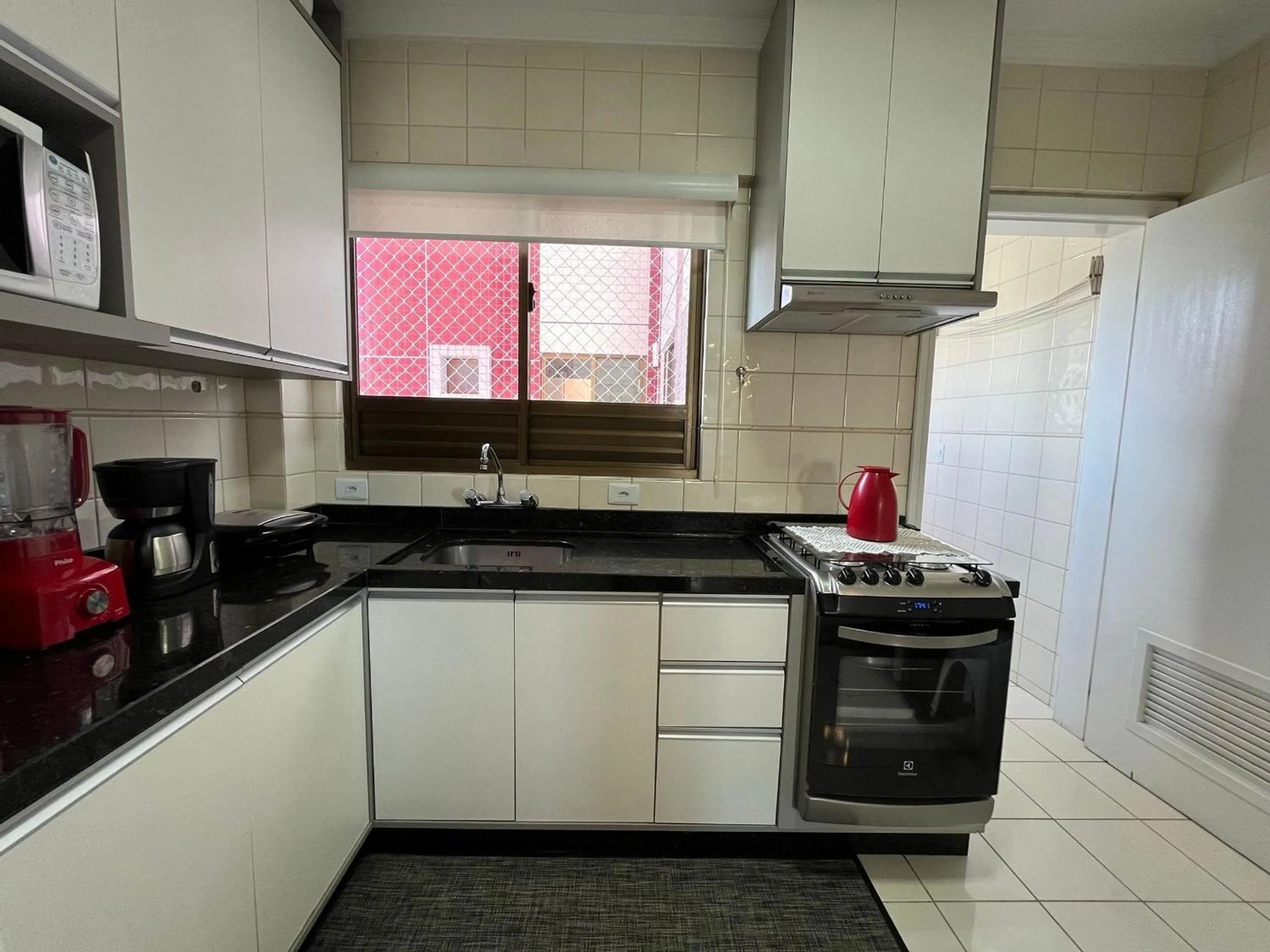 Kitchen or kitchenette in CT01- Vista mar| Telas Proteção| Churrasq, Garagem