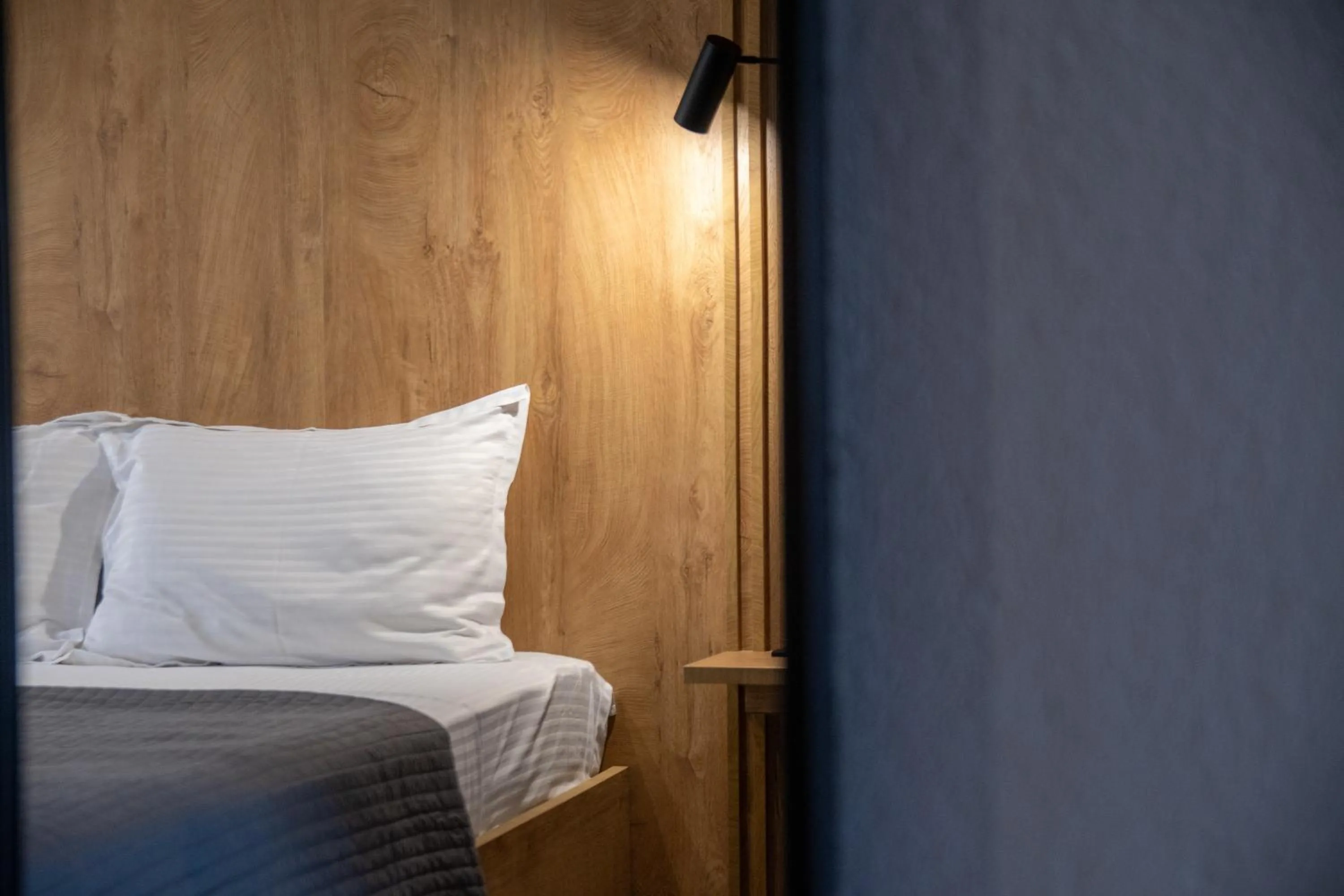 Bed in Unique Aura Luxury Studios