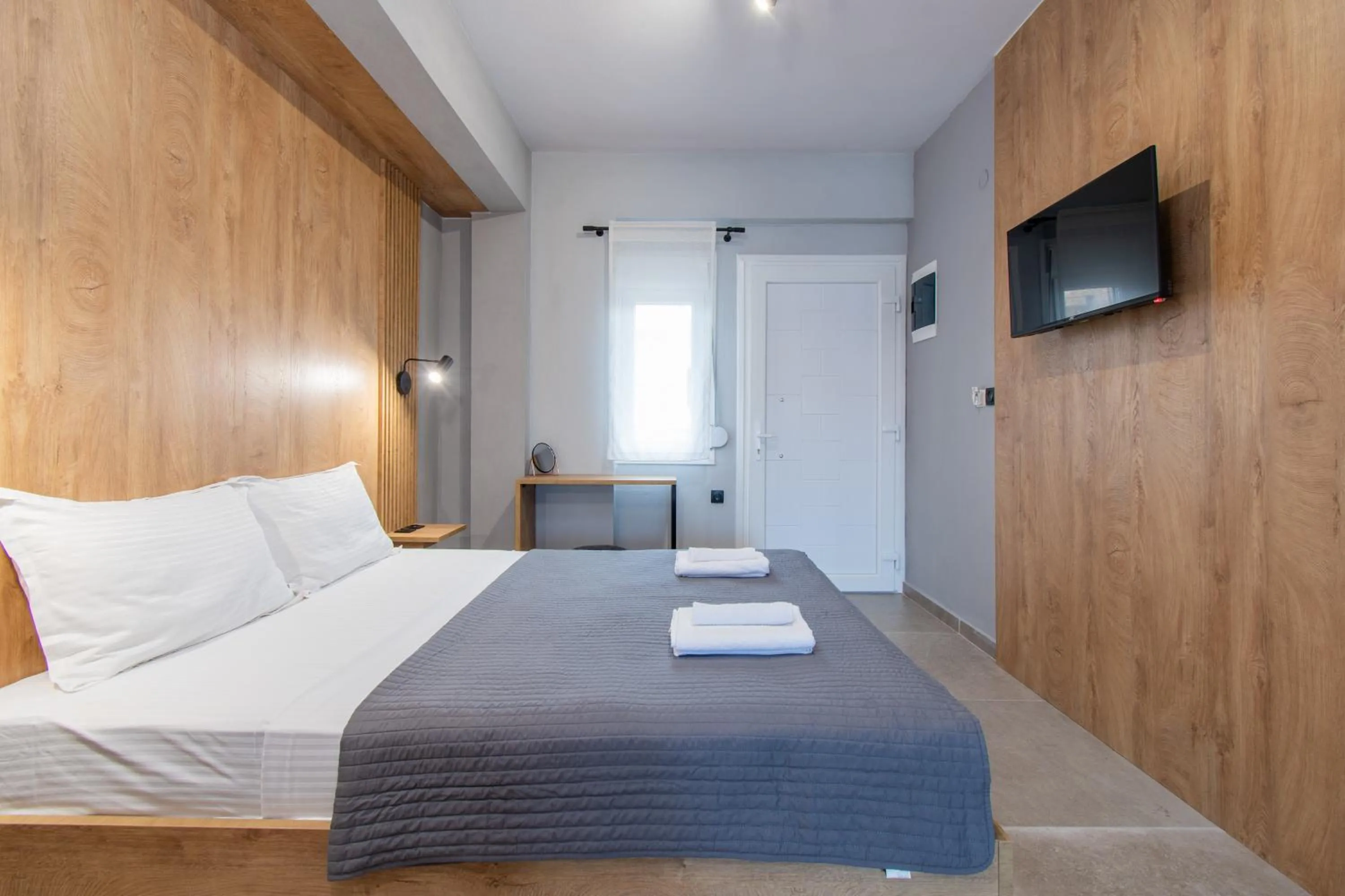 Bed in Unique Aura Luxury Studios