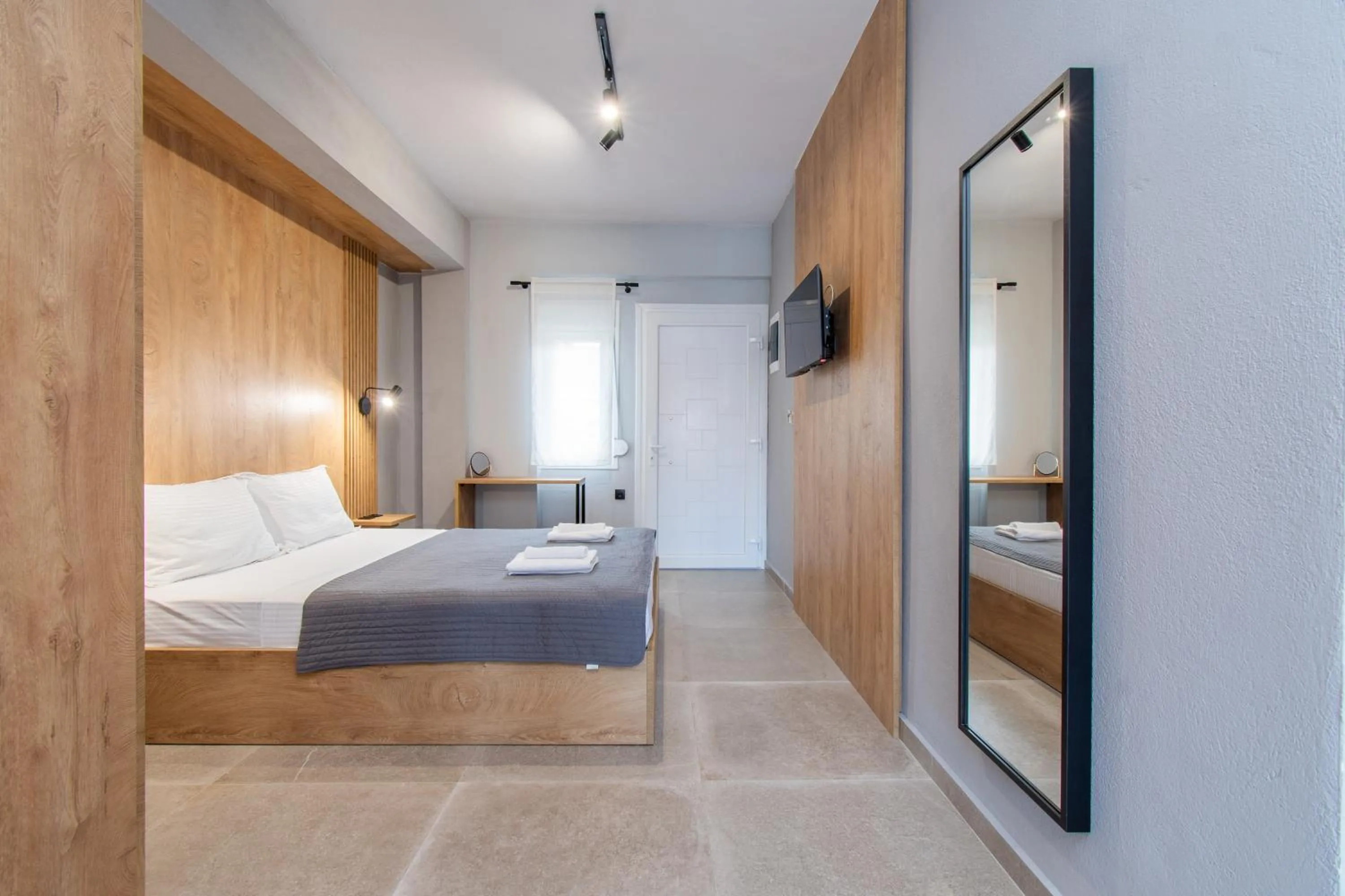 Bed in Unique Aura Luxury Studios