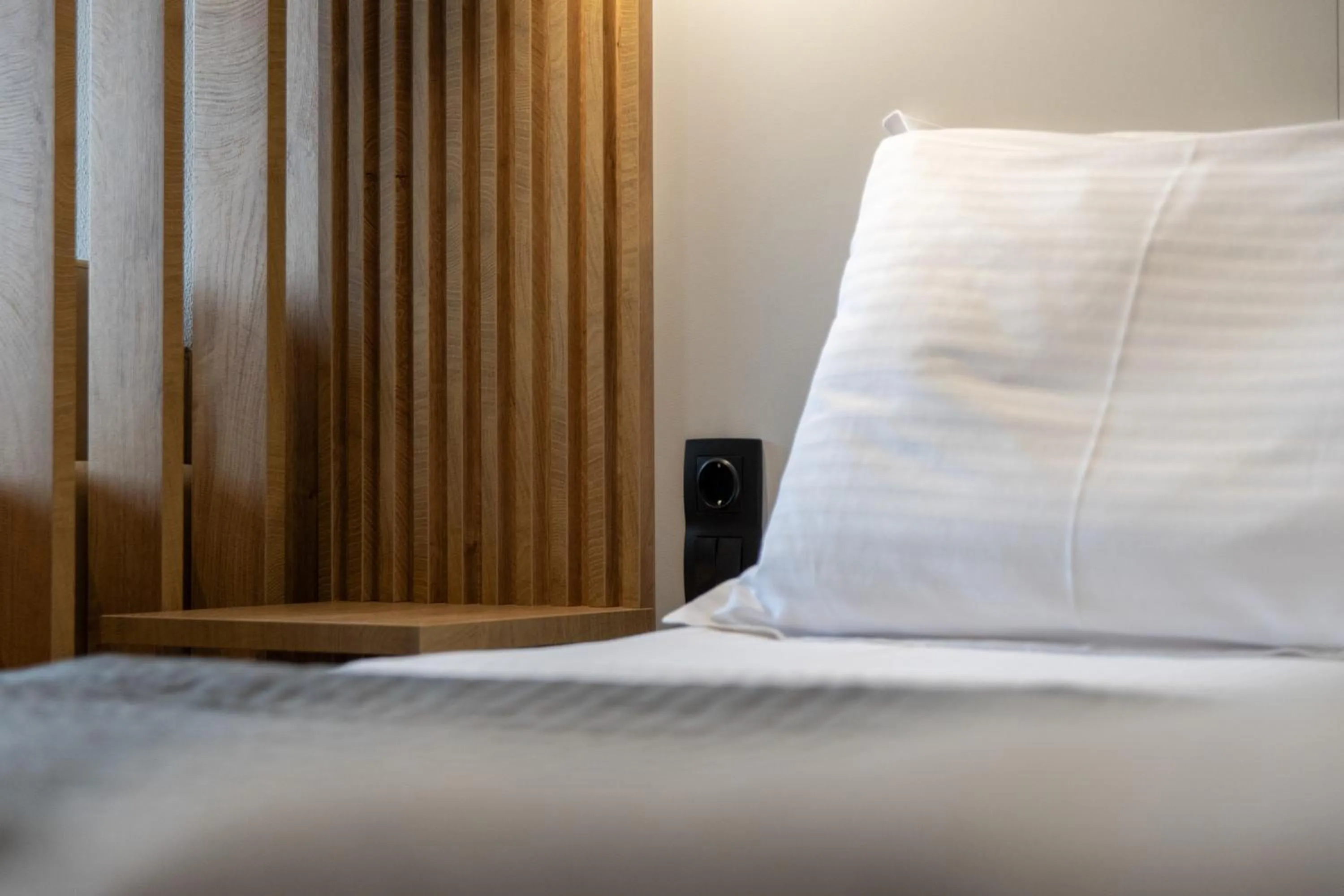 Bed in Unique Aura Luxury Studios