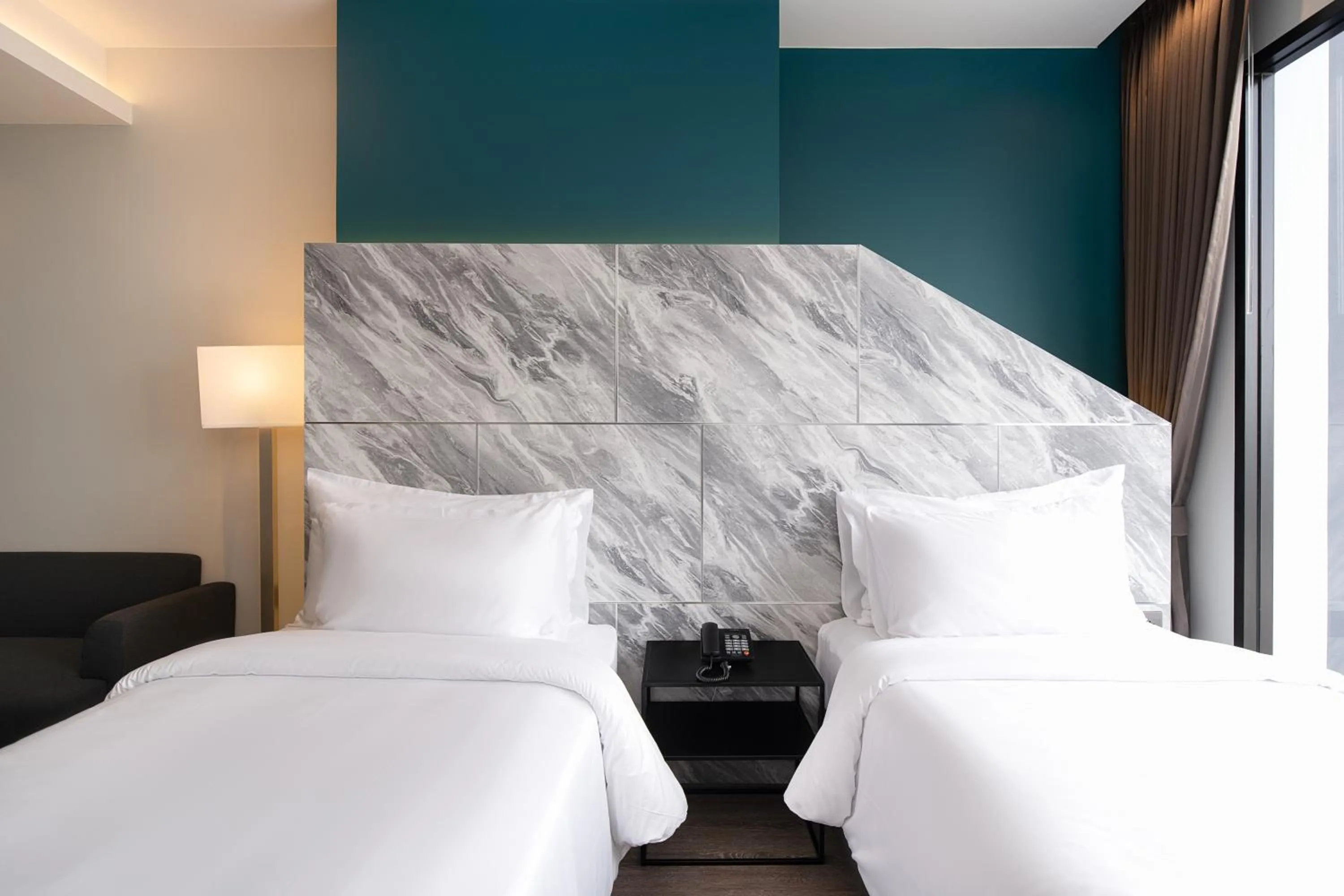 Bed in Thaya Hotel Bangkok