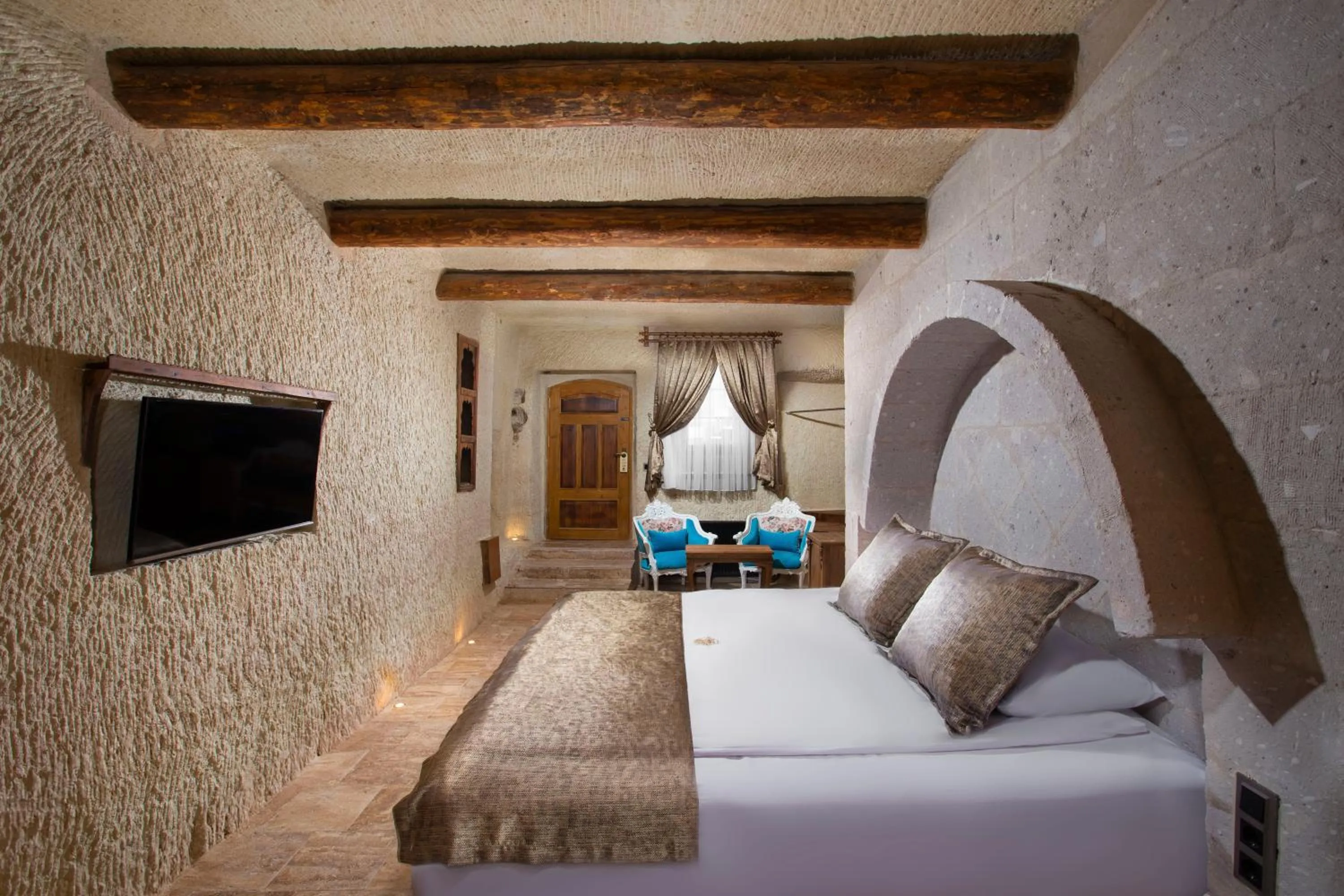 Bed in Dionysos Cave Cappadocia Hotel