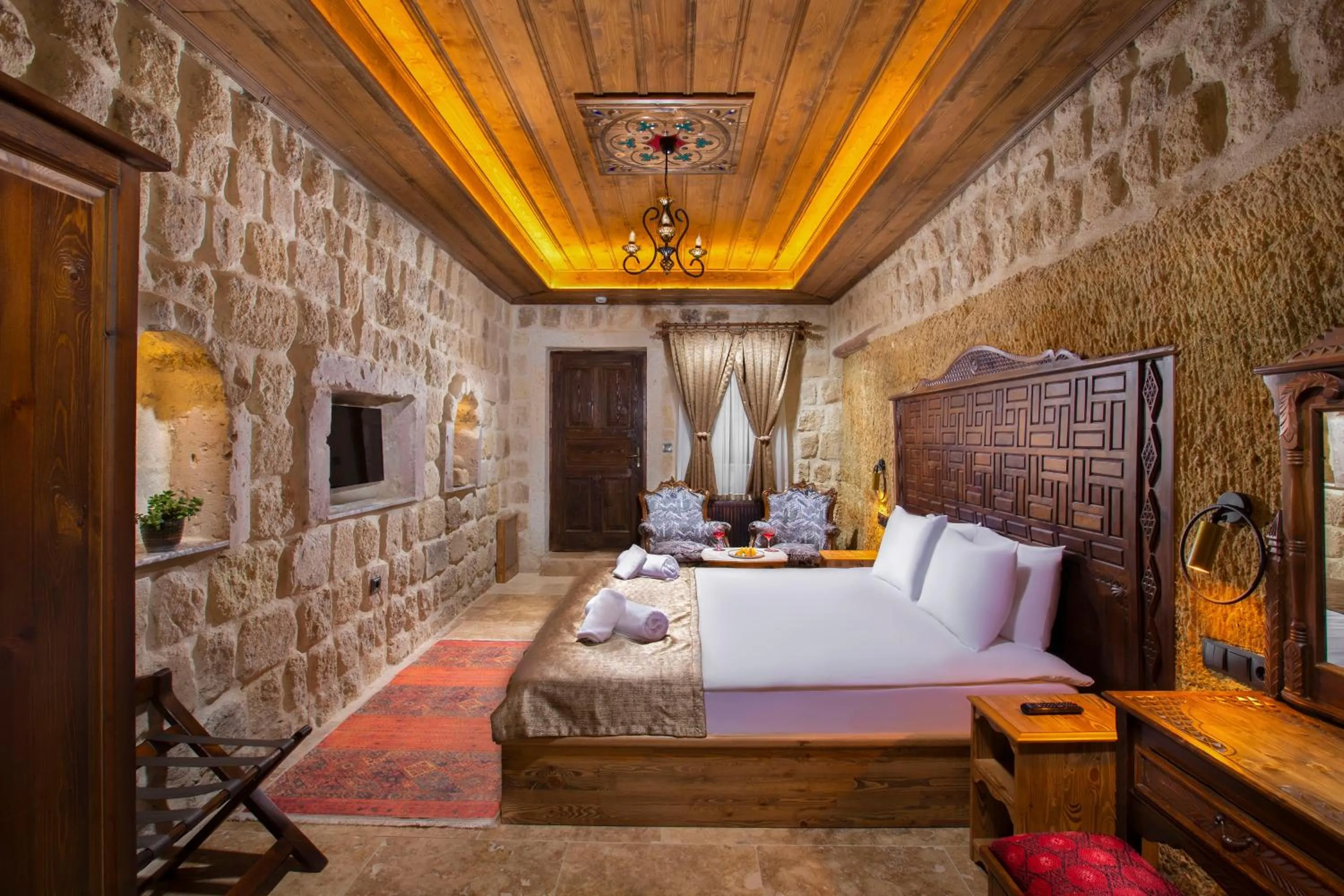 Photo of the whole room, Bed in Dionysos Cave Cappadocia Hotel