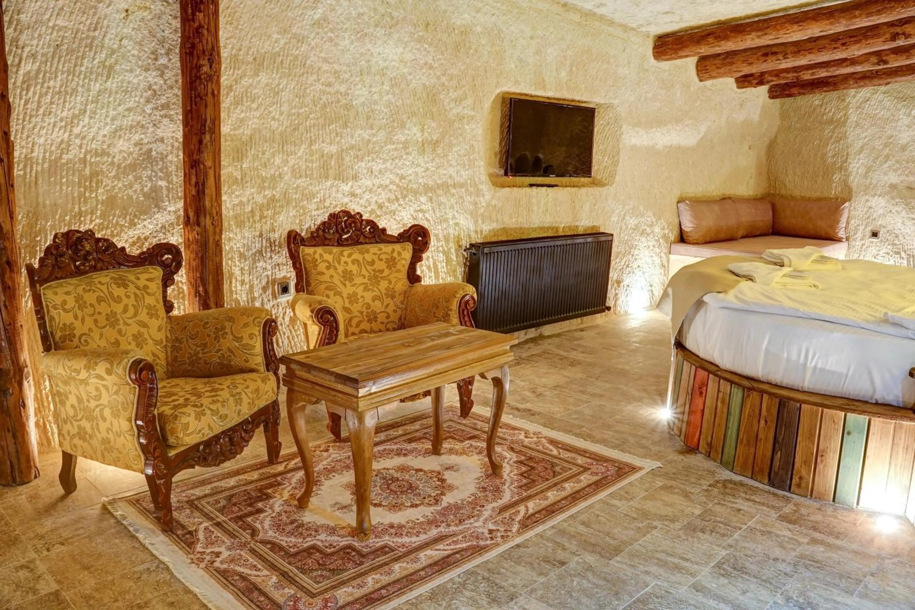 Seating area, Bed in Dionysos Cave Cappadocia Hotel