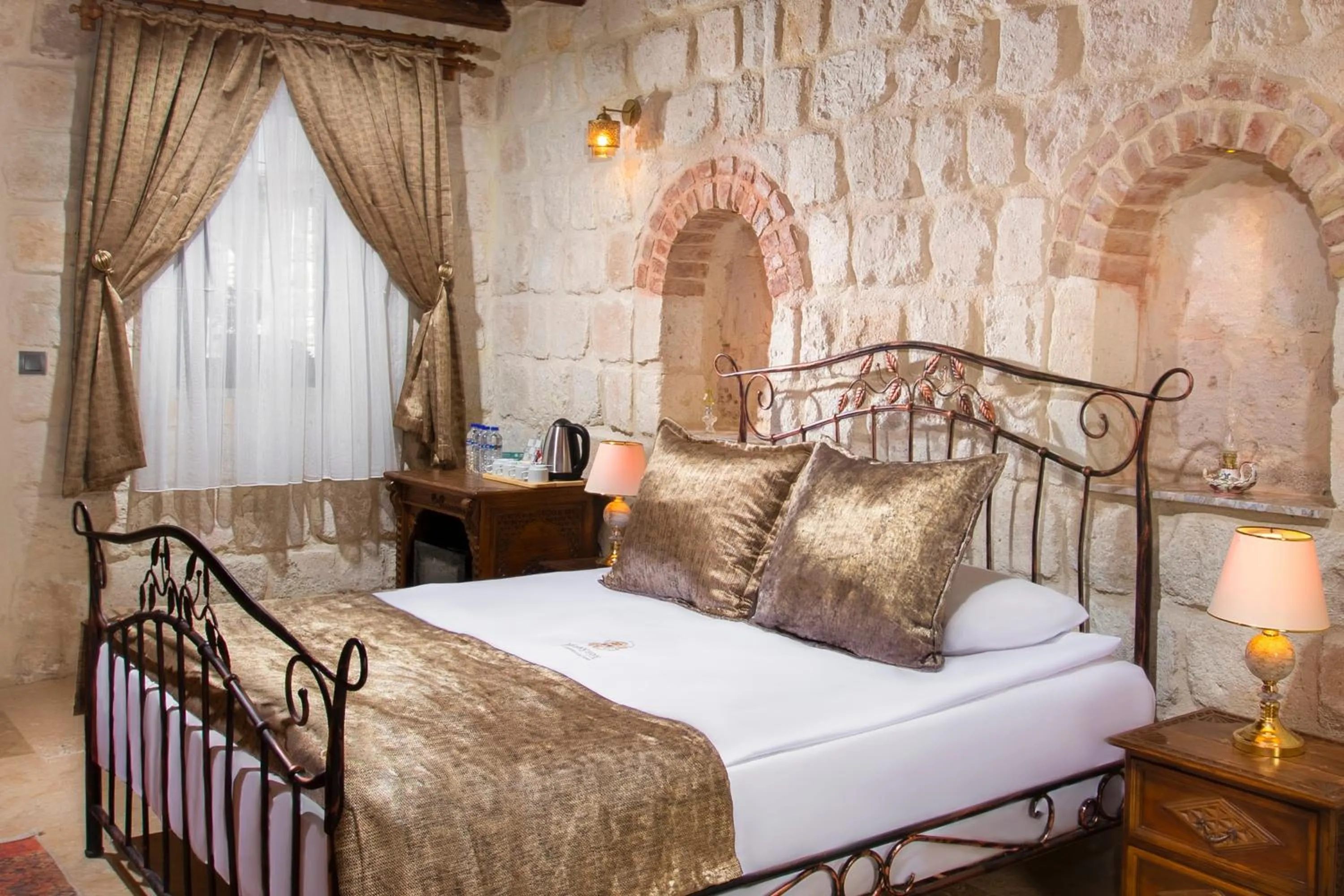 Bed in Dionysos Cave Cappadocia Hotel