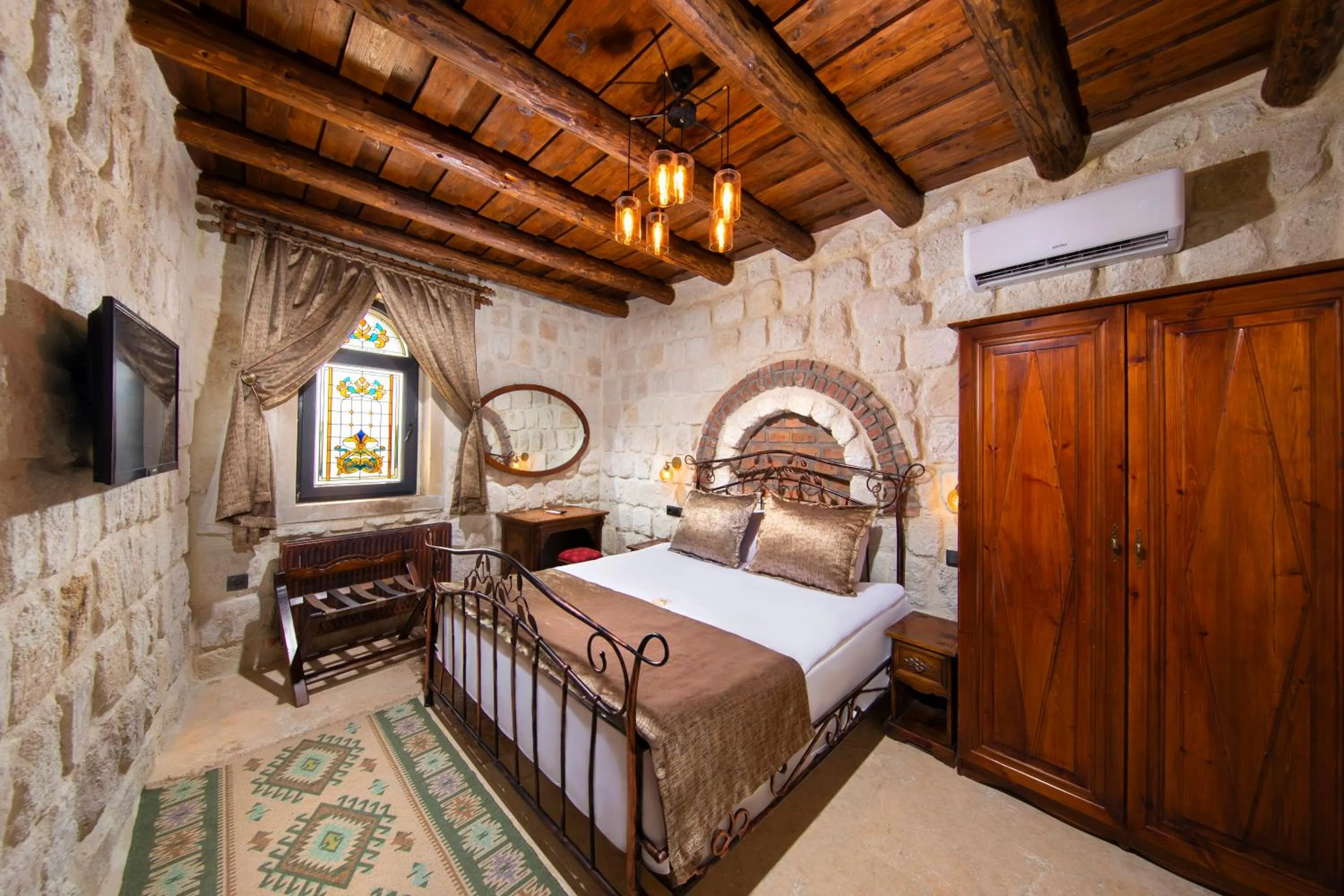 Bed in Dionysos Cave Cappadocia Hotel