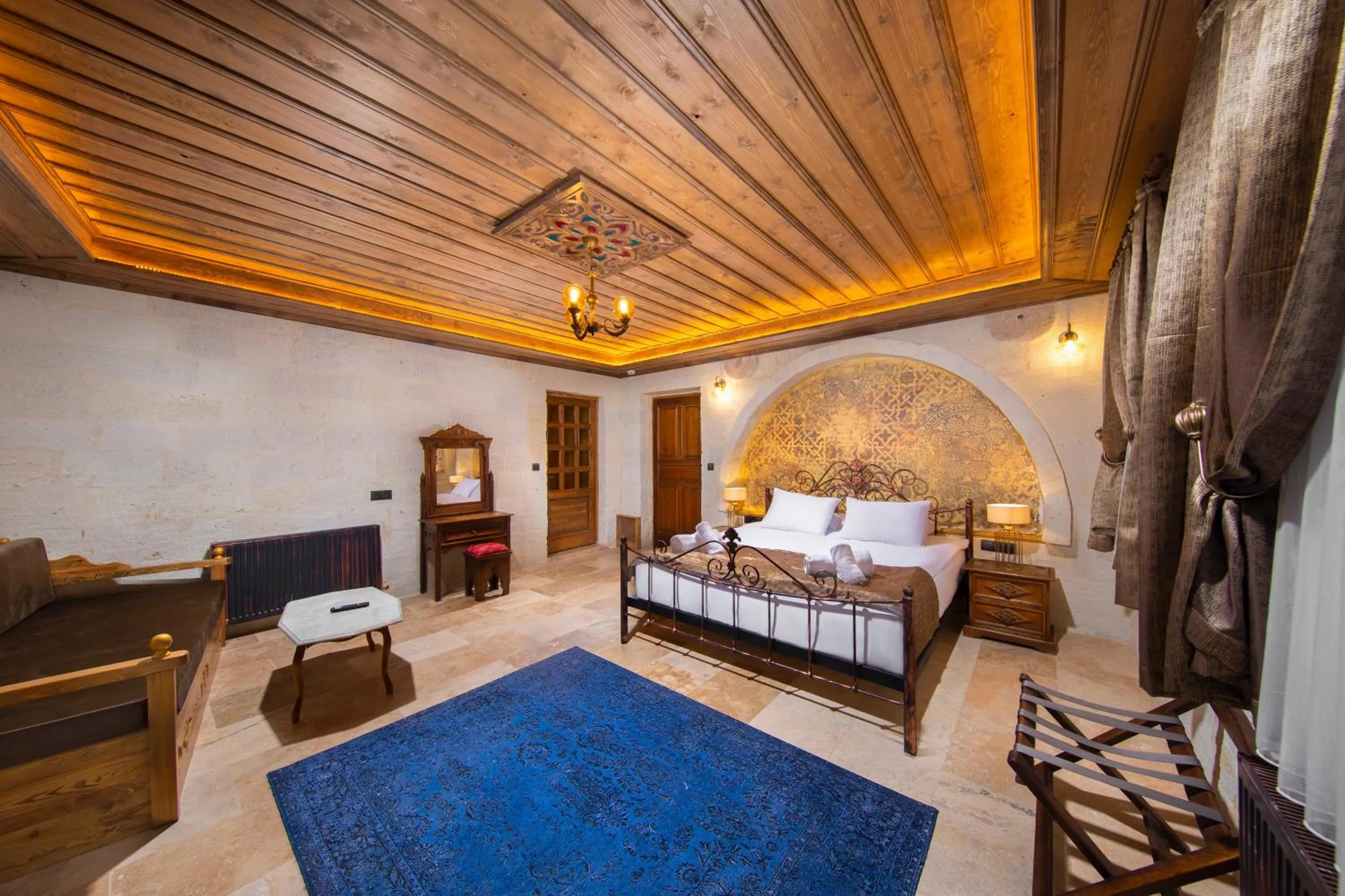Photo of the whole room, Bed in Dionysos Cave Cappadocia Hotel