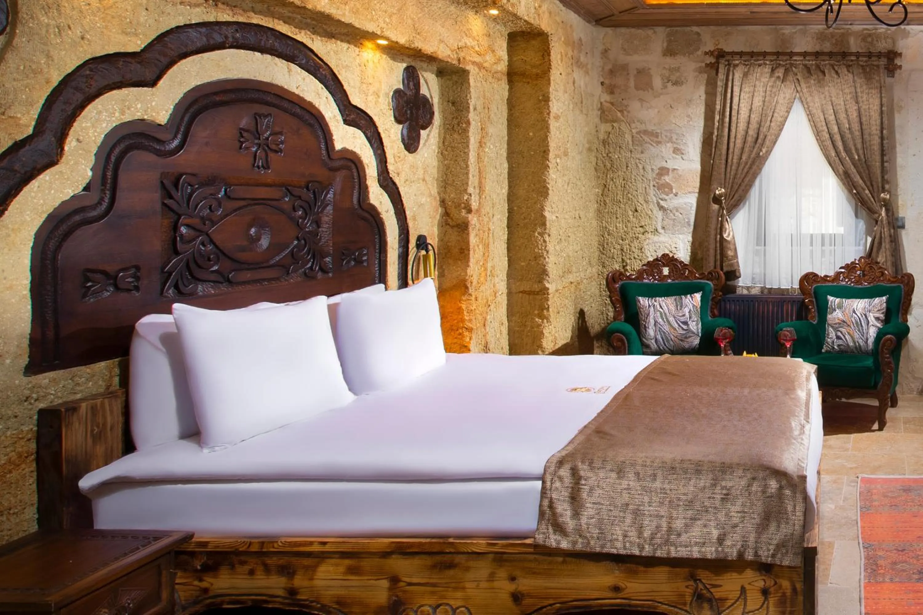 Bed in Dionysos Cave Cappadocia Hotel