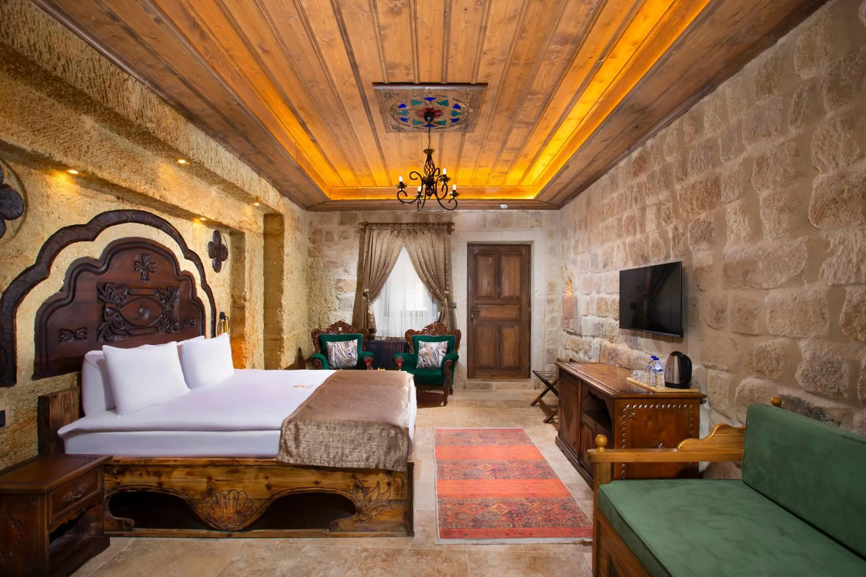 Photo of the whole room, Bed in Dionysos Cave Cappadocia Hotel