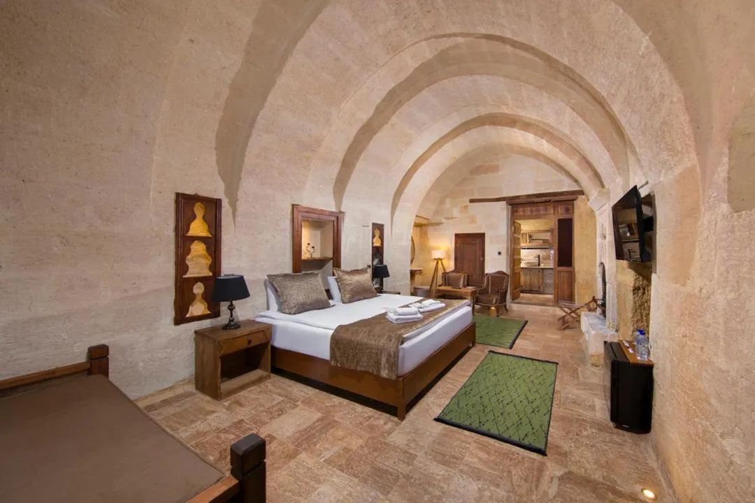 Photo of the whole room, Bed in Dionysos Cave Cappadocia Hotel
