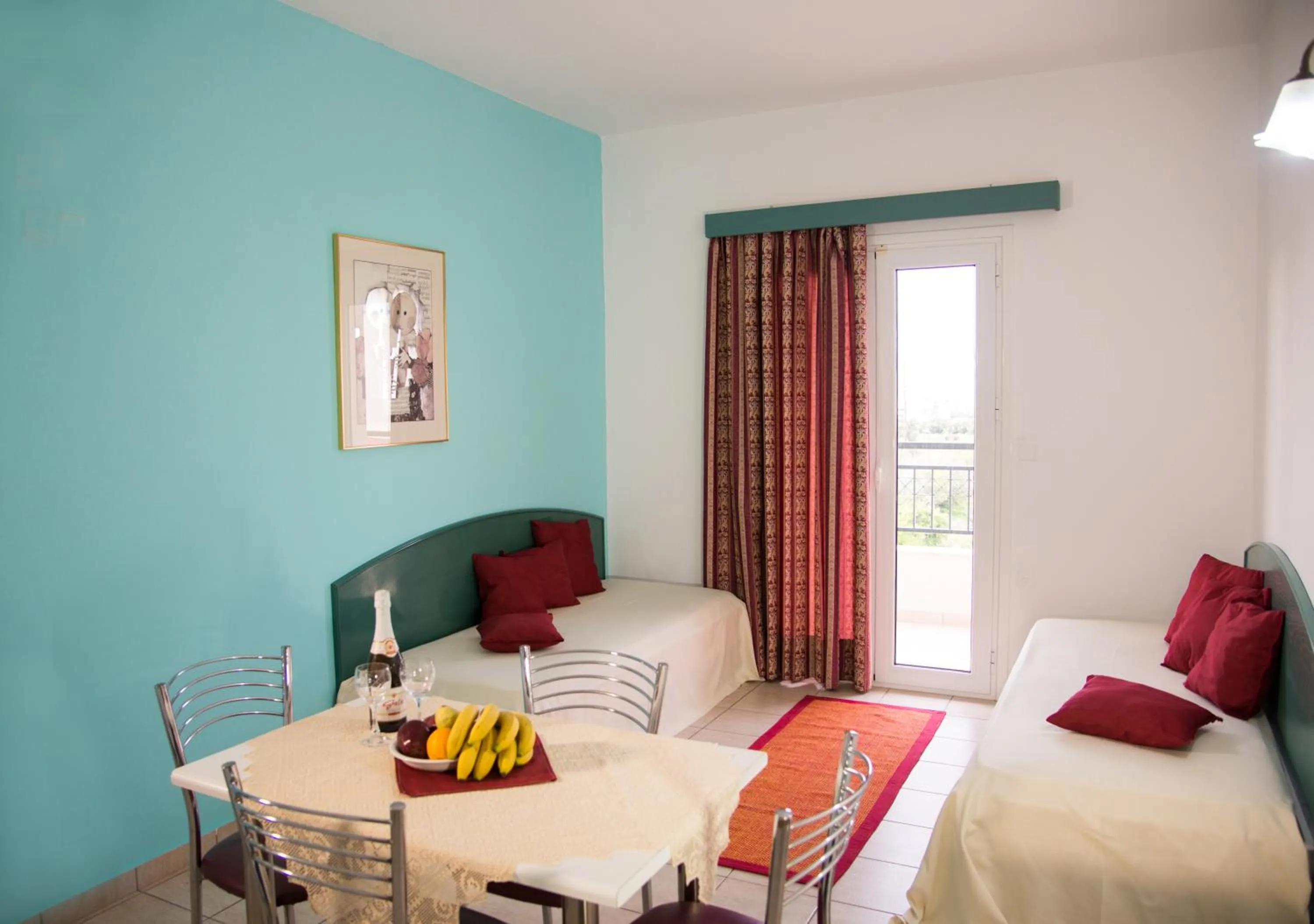 Living room, Bed in Theoni Apartments