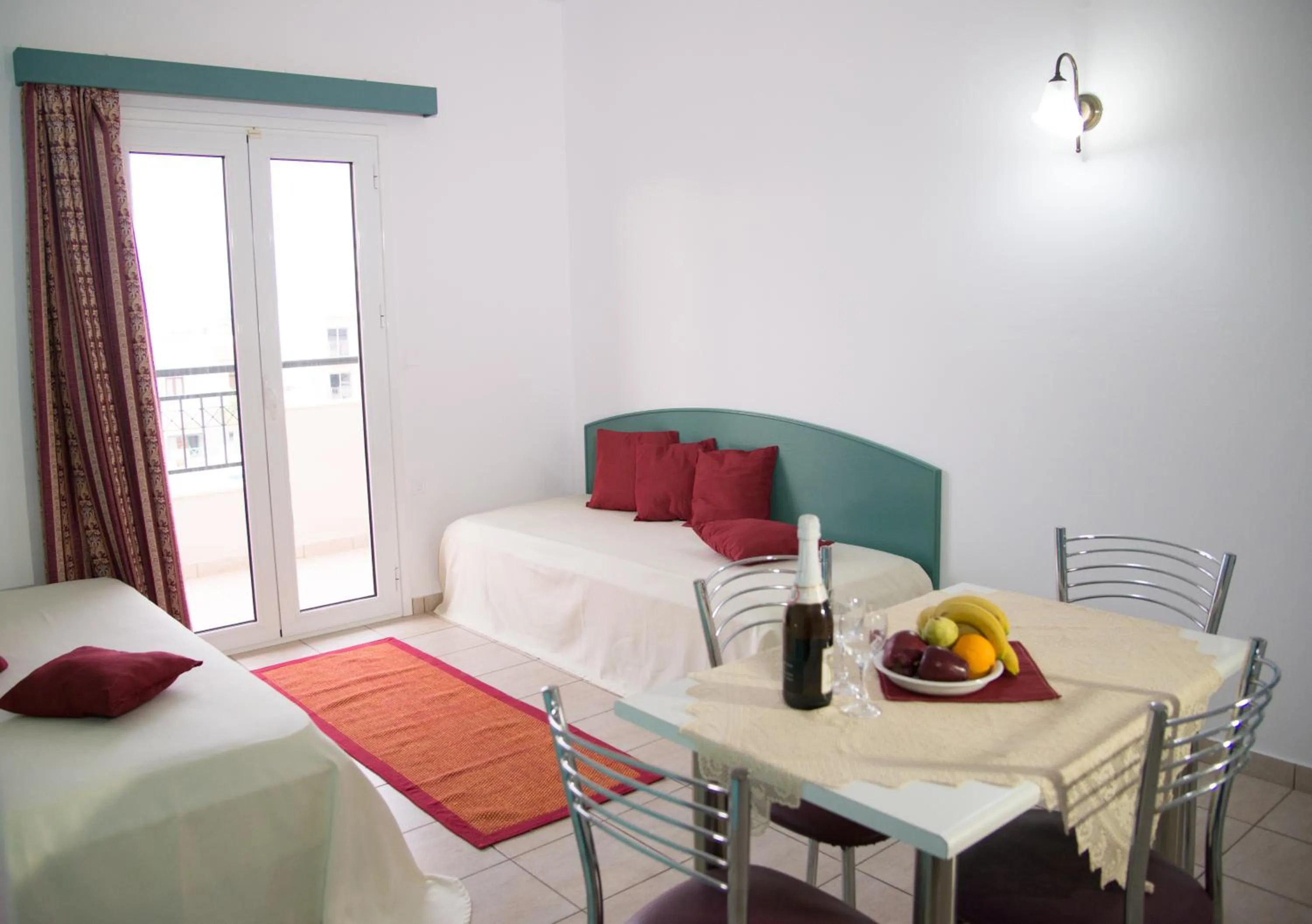 Living room, Bed in Theoni Apartments