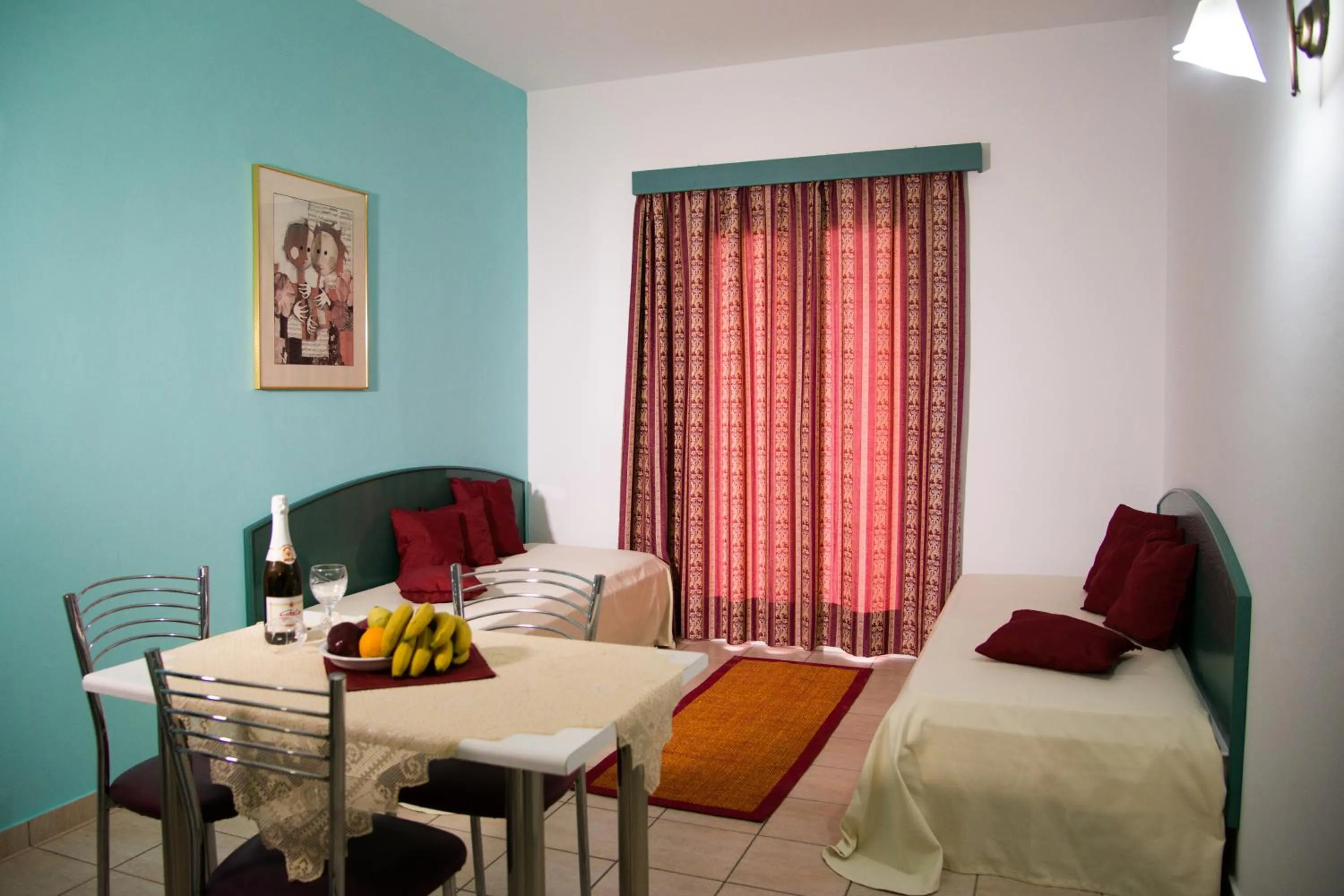 Living room, Bed in Theoni Apartments