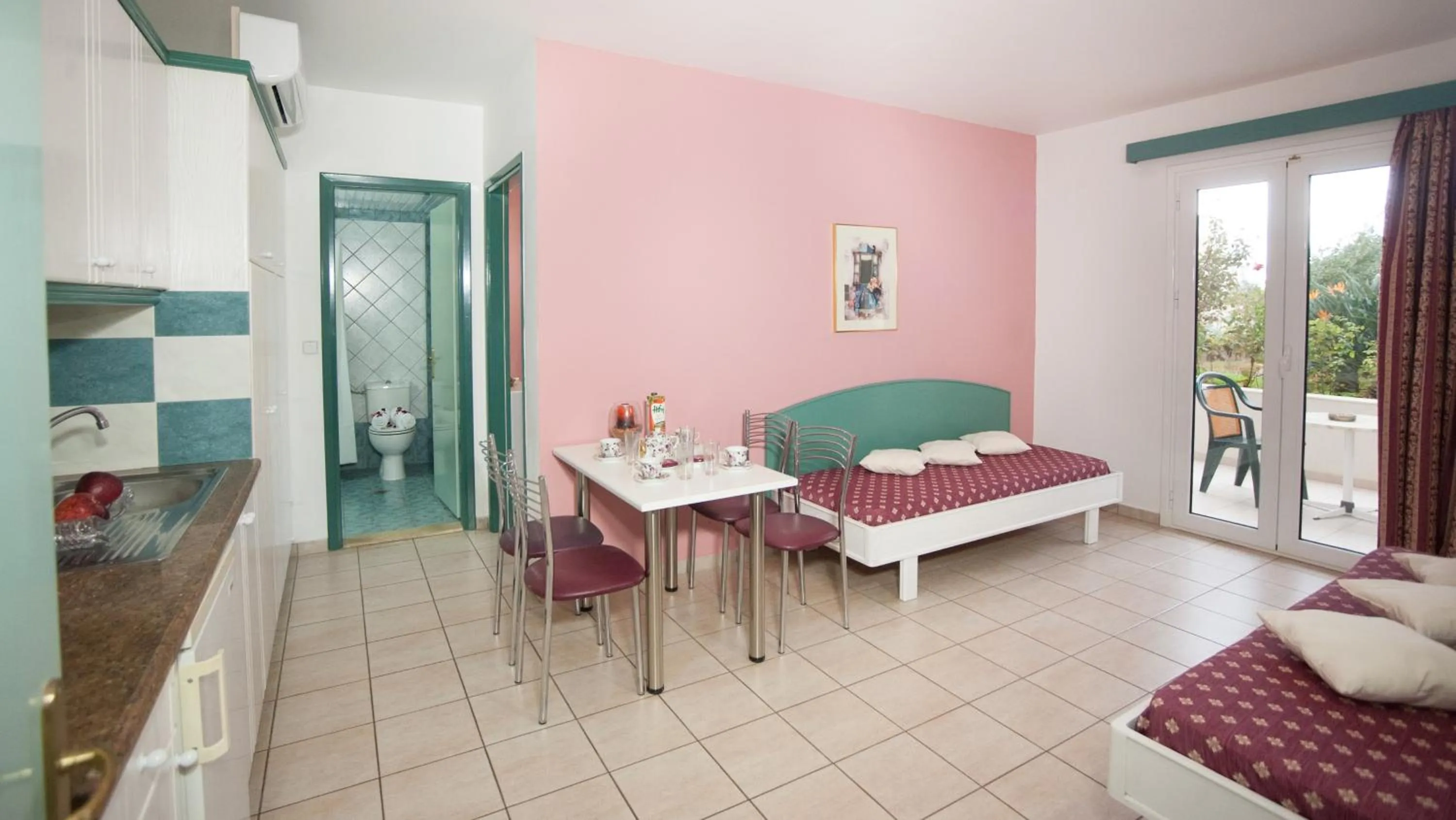 Kitchen or kitchenette, Bed in Theoni Apartments